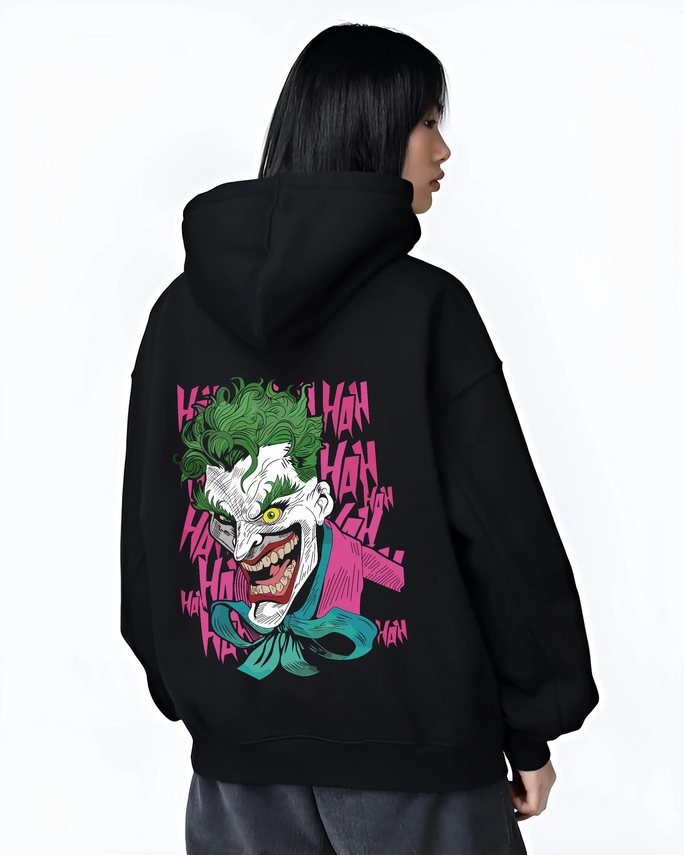 Black hoodie worn by female model, back view with Joker Hoodie Gotham Anime Inspired Laughing Villain Design graphic Joker anime design.