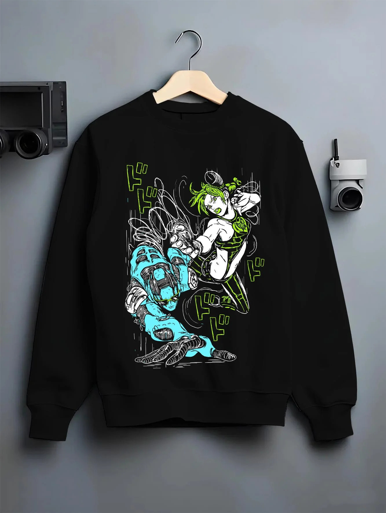 Black crewneck sweatshirt on hanger with Jolyne Cujoh Hoodie JoJo’s Bizarre Adventure Anime Pose graphic streetwear graphic.