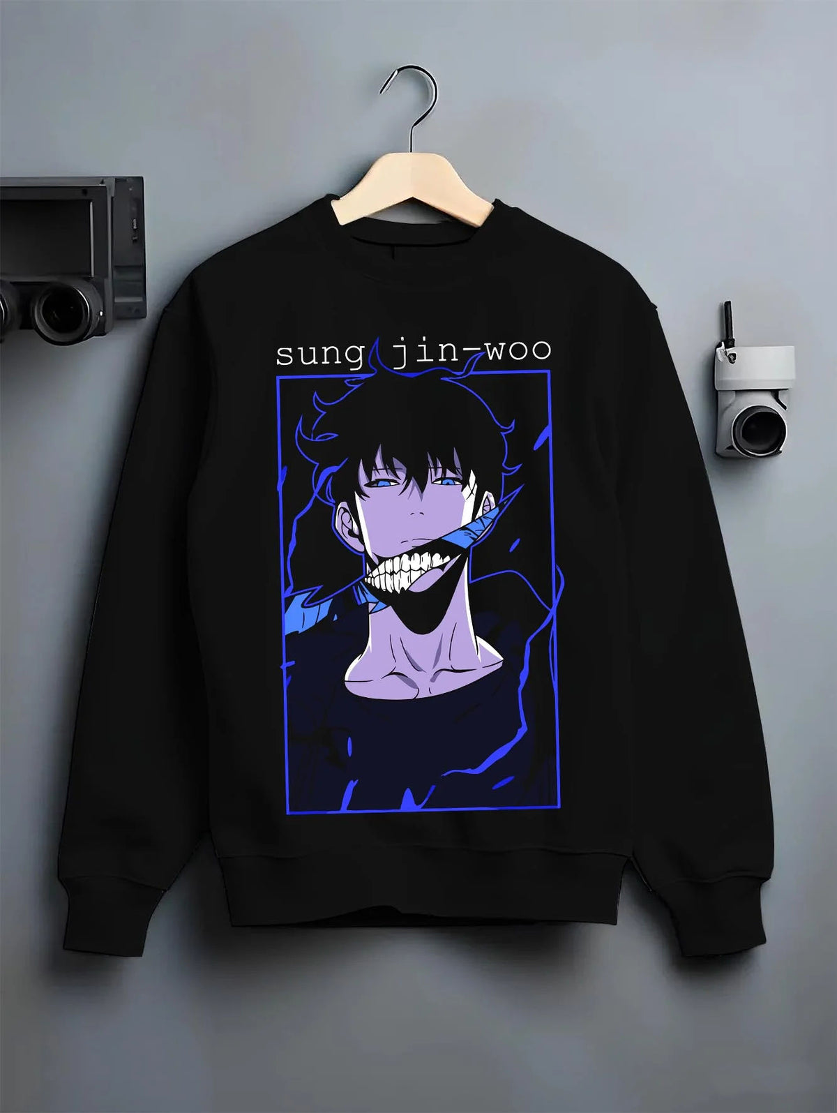 Black crewneck sweatshirt on hanger featuring Sung Jin-Woo blue aura Shadow Monarch artwork.