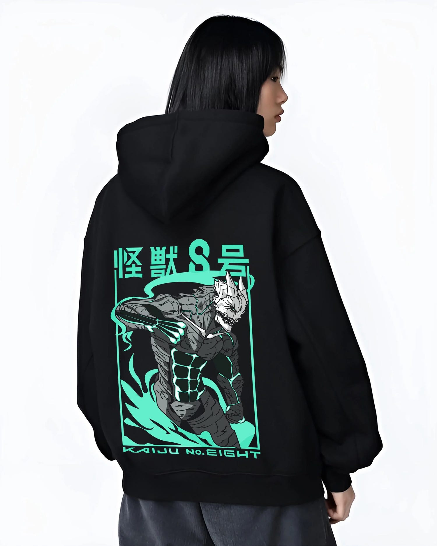 Black hoodie worn by female model, back view with Kaiju No. 8 Hoodie Anime Kaiju Monster Fight Design graphic streetwear graphic.