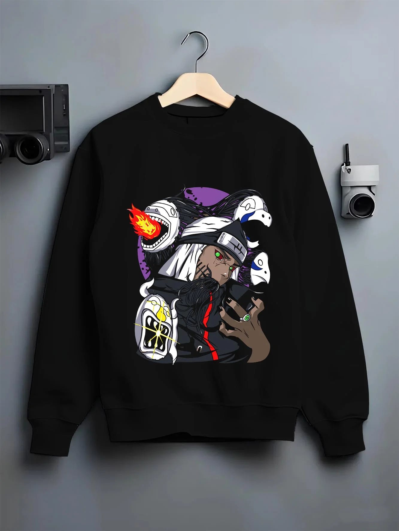 Black crewneck sweatshirt on hanger with Kakuzu Hoodie Naruto Akatsuki Immortal Shinobi graphic premium wear.