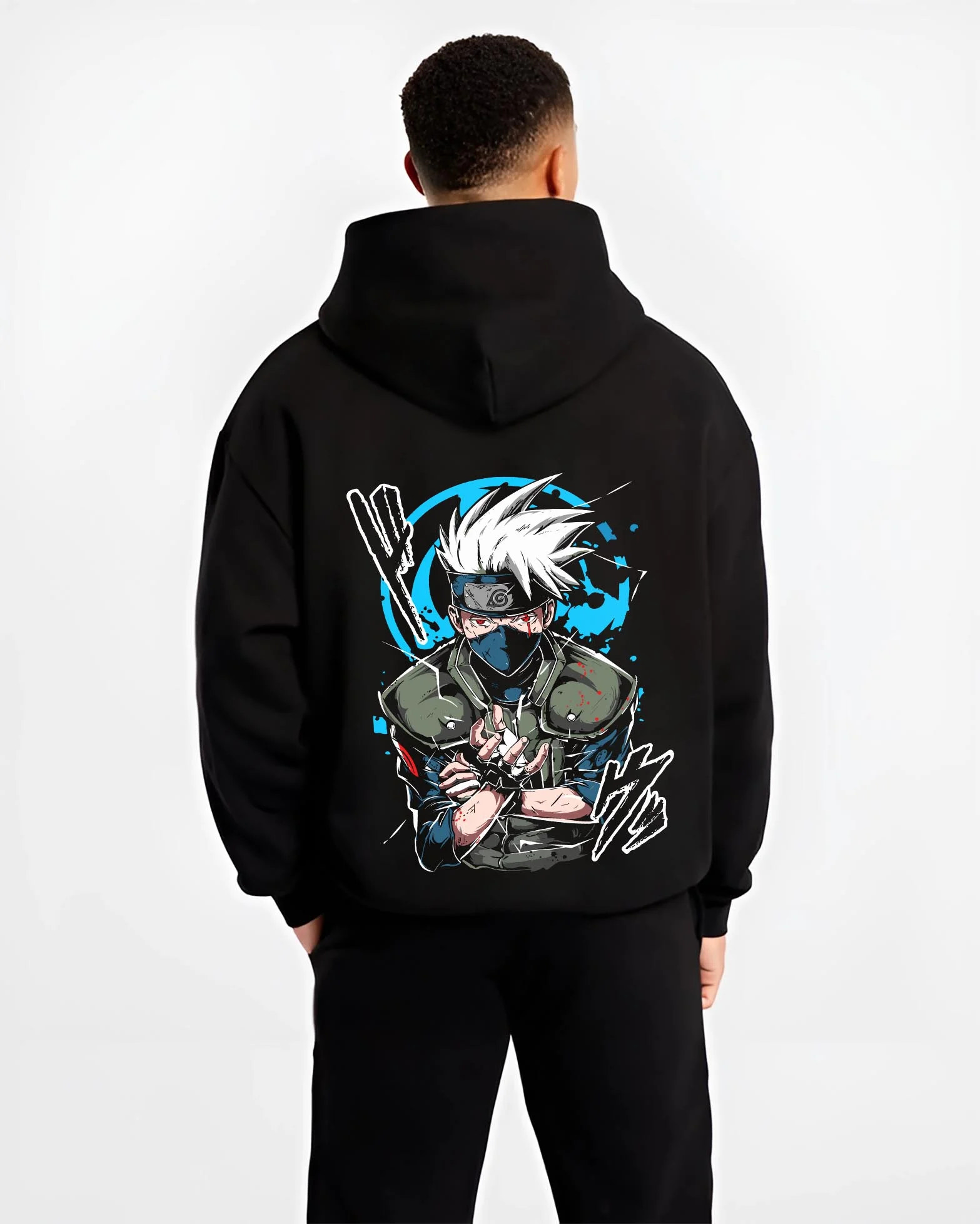 Black hoodie worn by male model, back view with Kakashi Hatake Hoodie Naruto Copy Ninja Jonin Leader graphic bold anime graphic.