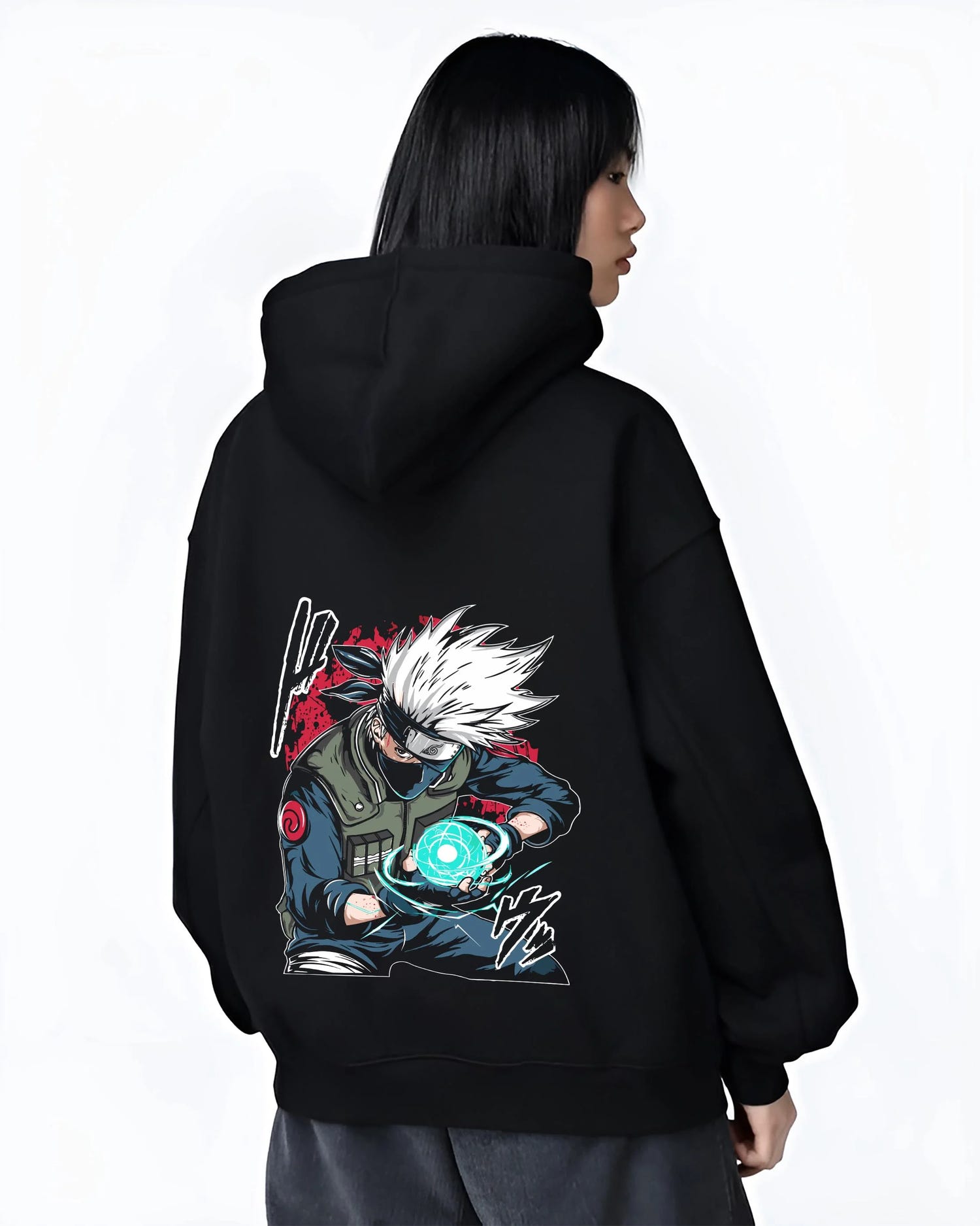Black hoodie worn by female model, back view with Kakashi Hatake Hoodie Naruto Rasengan Jonin Pose graphic bold anime graphic.
