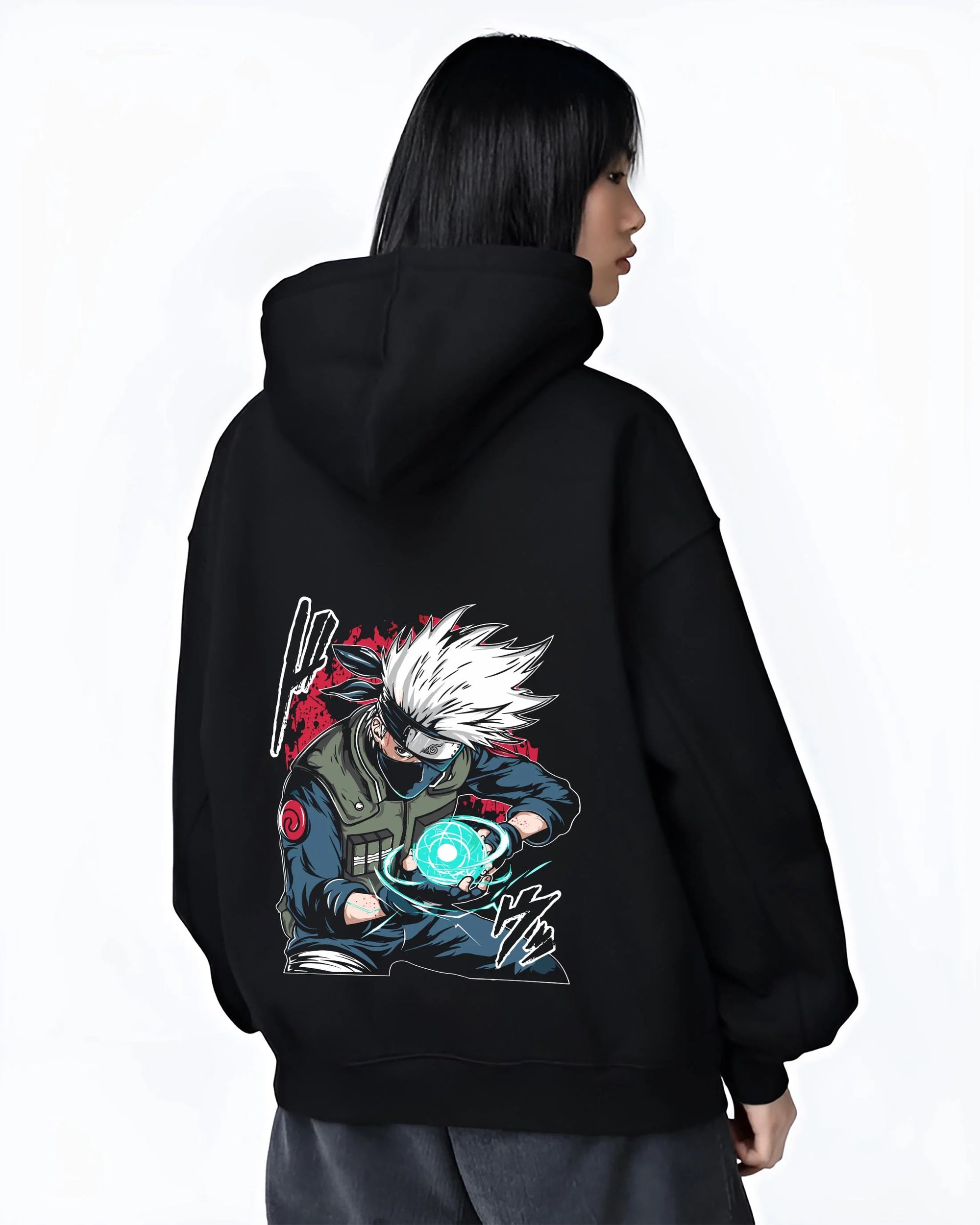 Black hoodie worn by female model, back view with Kakashi Hatake Hoodie Naruto Rasengan Jonin Pose graphic bold anime graphic.