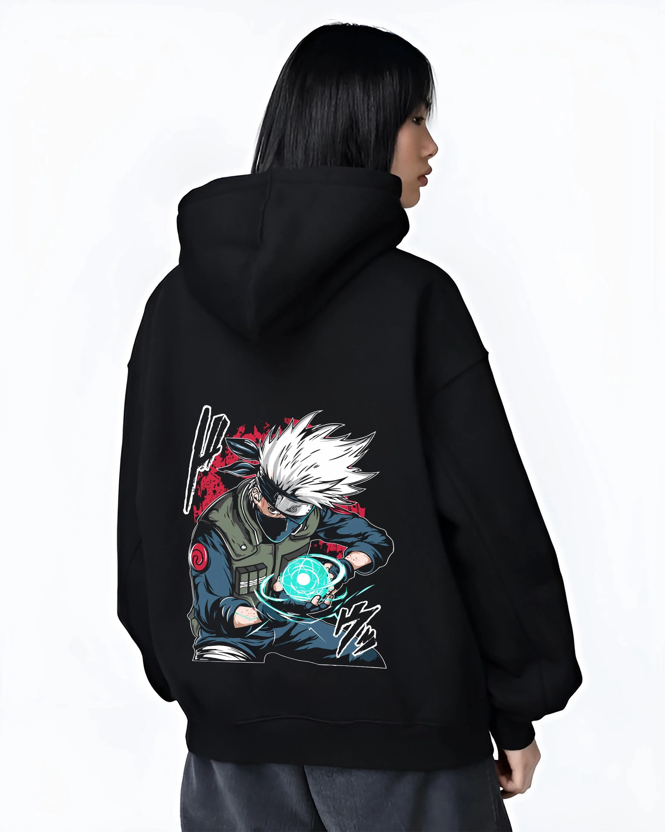 Black hoodie worn by female model, back view with Kakashi Hatake Hoodie Naruto Rasengan Jonin Pose graphic bold anime graphic.