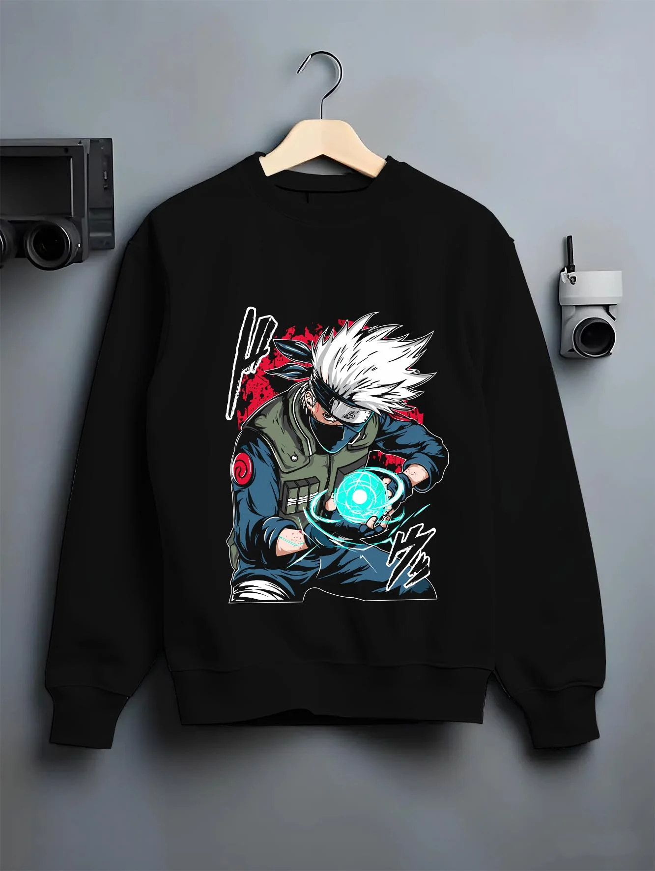 Black crewneck sweatshirt on hanger with Kakashi Hatake Hoodie Naruto Rasengan Jonin Pose graphic premium wear.