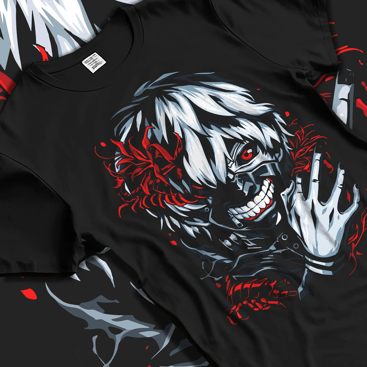 Black T-shirt laid flat with natural folds featuring Ken Kaneki kagune awakening artwork.