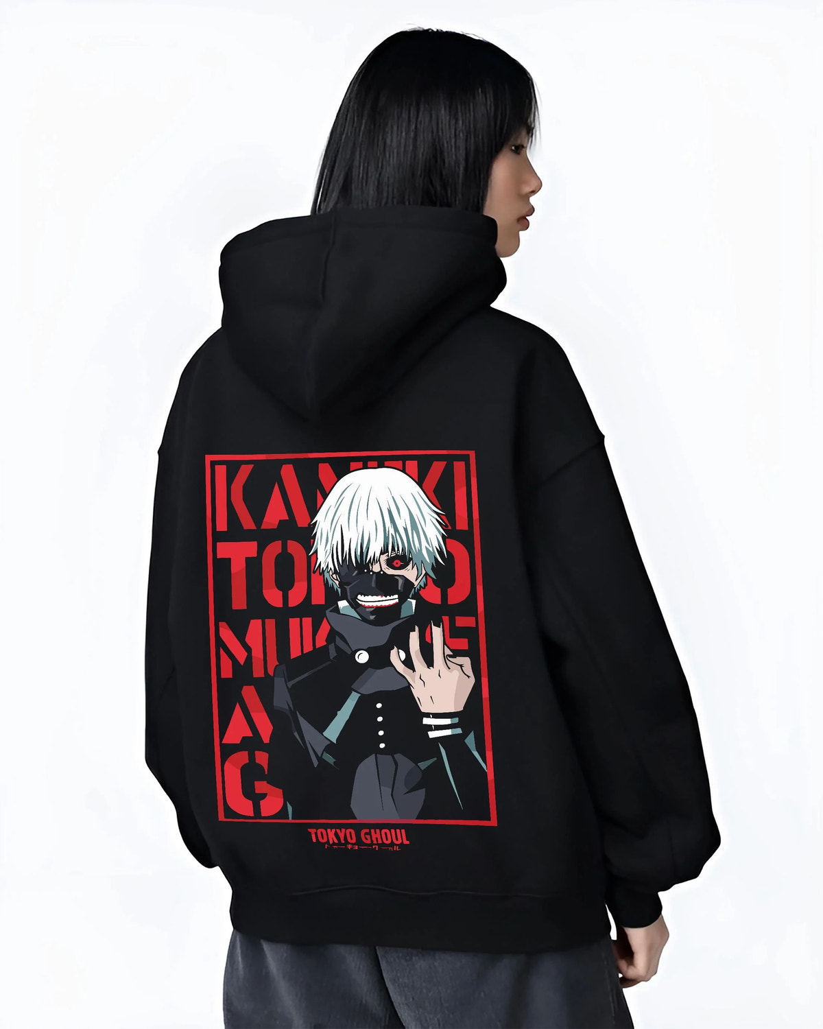 Black hoodie worn by female model from the back featuring Ken Kaneki one-eye ghoul portrait artwork.