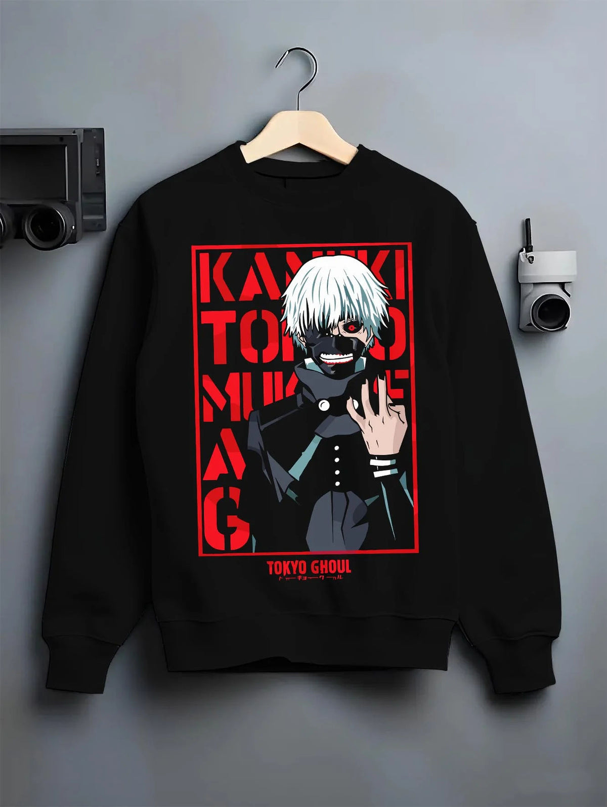 Black crewneck sweatshirt on hanger featuring Ken Kaneki one-eye ghoul portrait artwork.