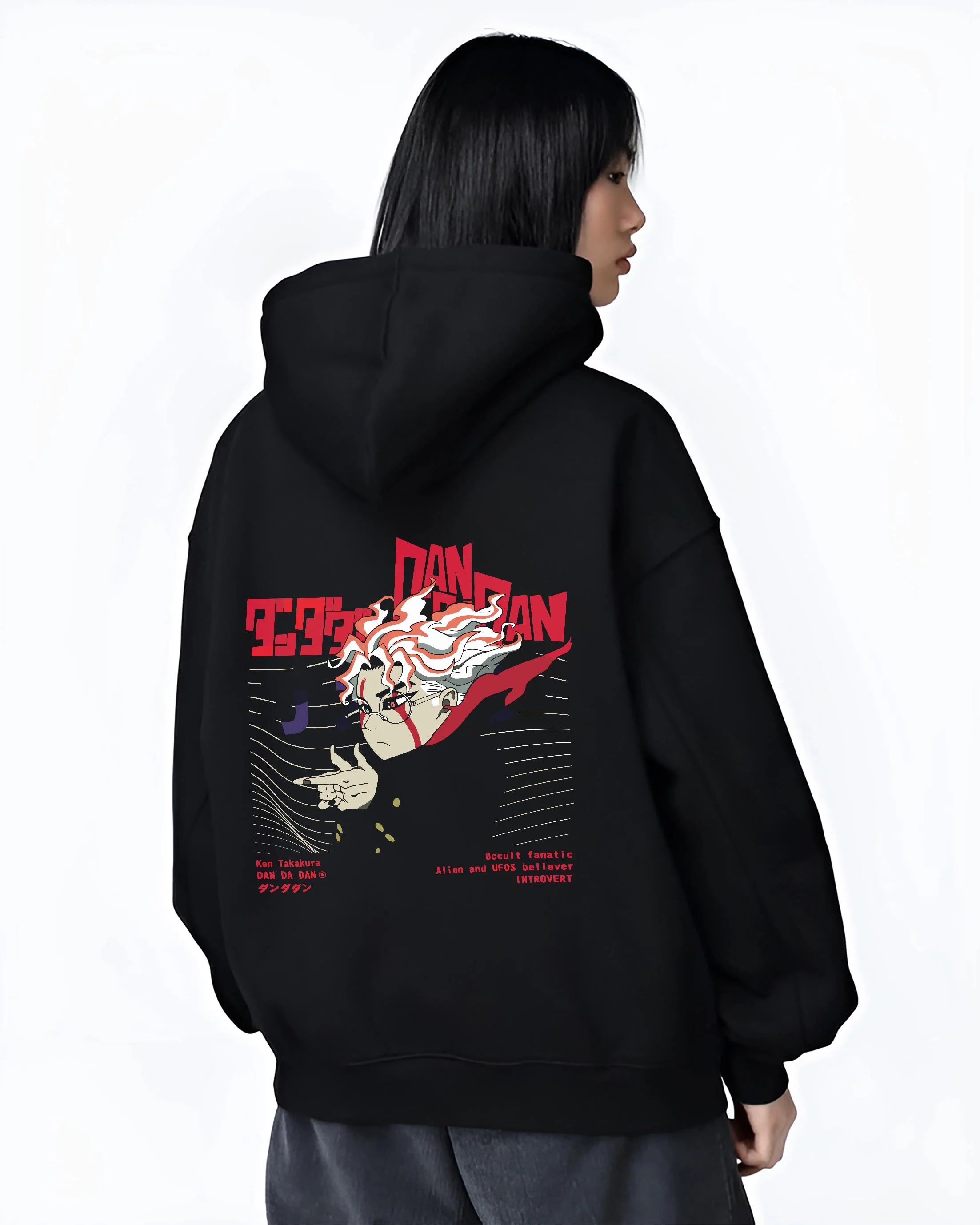 Black hoodie worn by female model, back view with Ken Takakura Dandadan Hoodie Occult UFO Believer Retro graphic streetwear graphic.