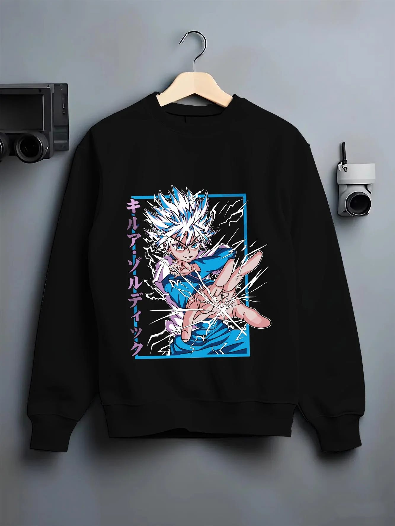 Black crewneck sweatshirt on hanger with Killua Zoldyck Hoodie Hunter x Hunter Lightning Charge graphic bold anime graphic.