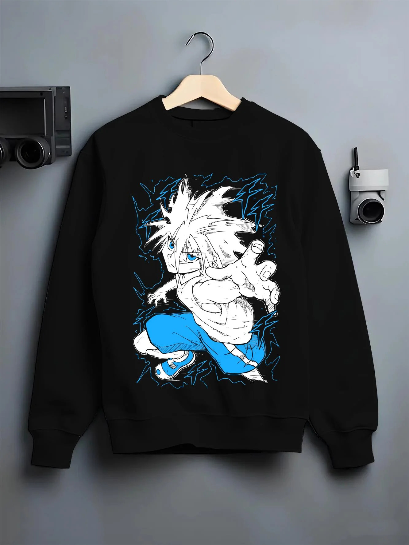 Black crewneck sweatshirt on hanger with Killua Zoldyck Hoodie Hunter x Hunter Godspeed Power graphic streetwear graphic.