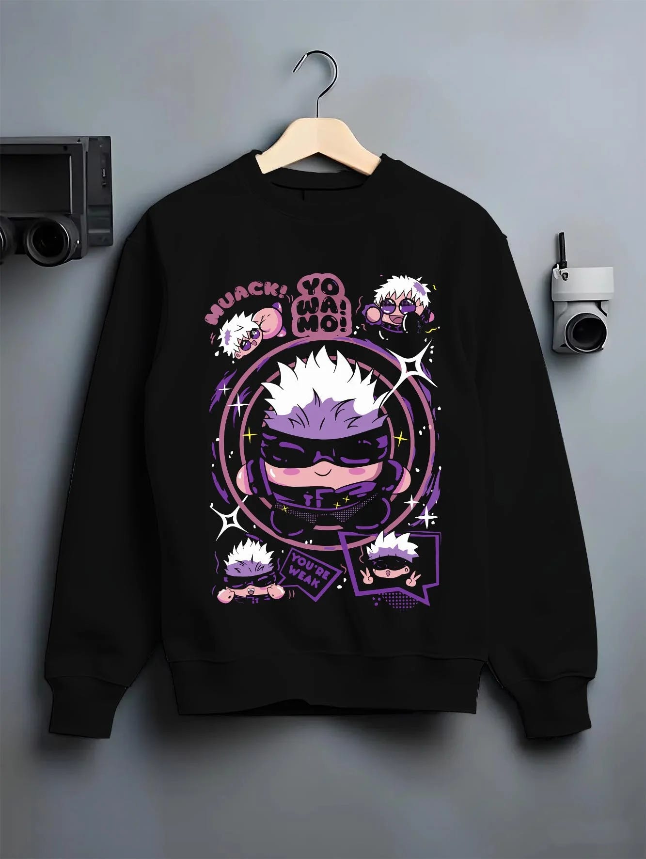 Black crewneck sweatshirt on hanger with Gojo Satoru Hoodie Jujutsu Kaisen Chibi Funny Faces graphic bold anime graphic.