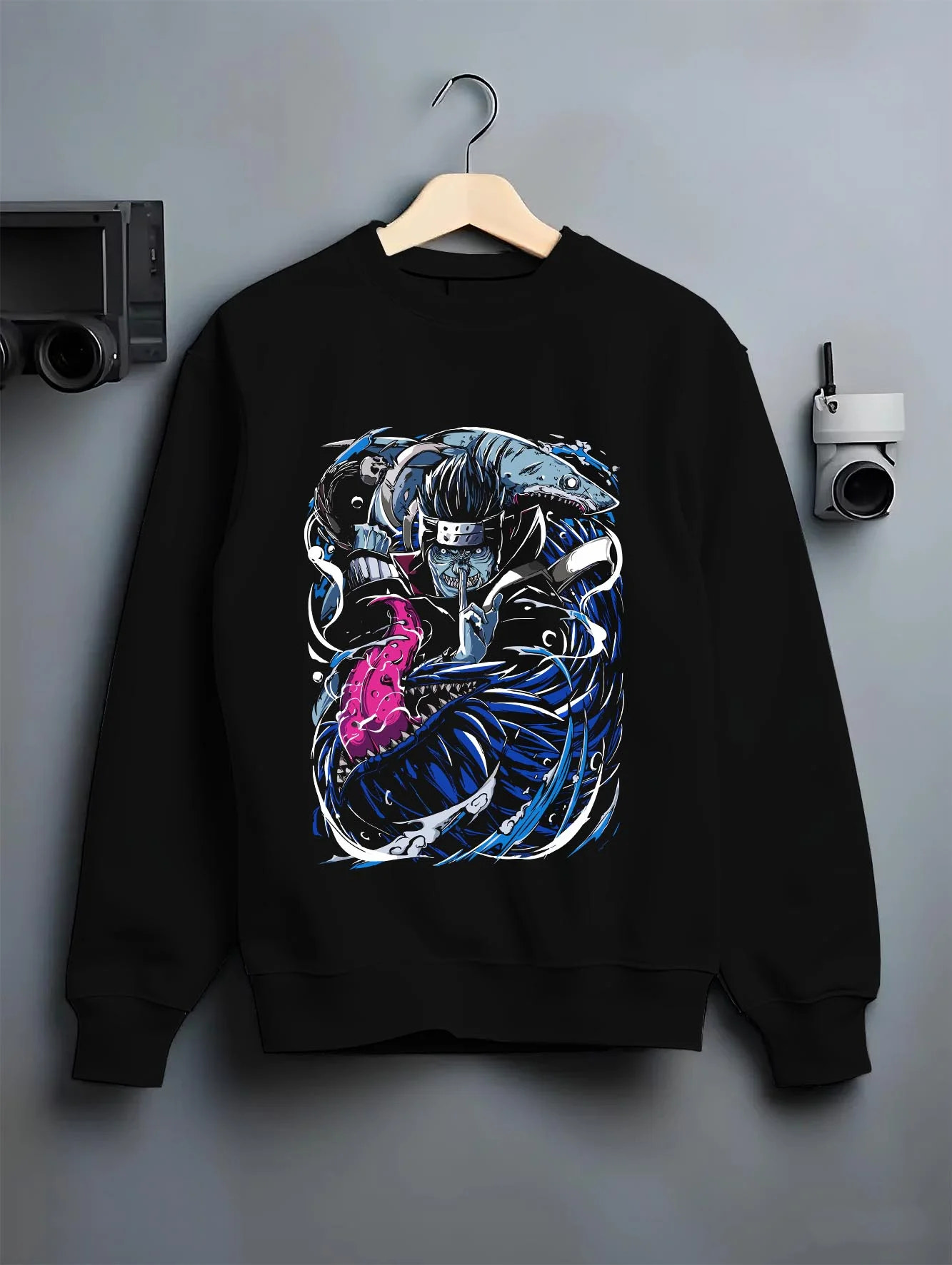 Black crewneck sweatshirt on hanger with Kisame Hoodie Naruto Akatsuki Shark Samehada Blade graphic premium wear.