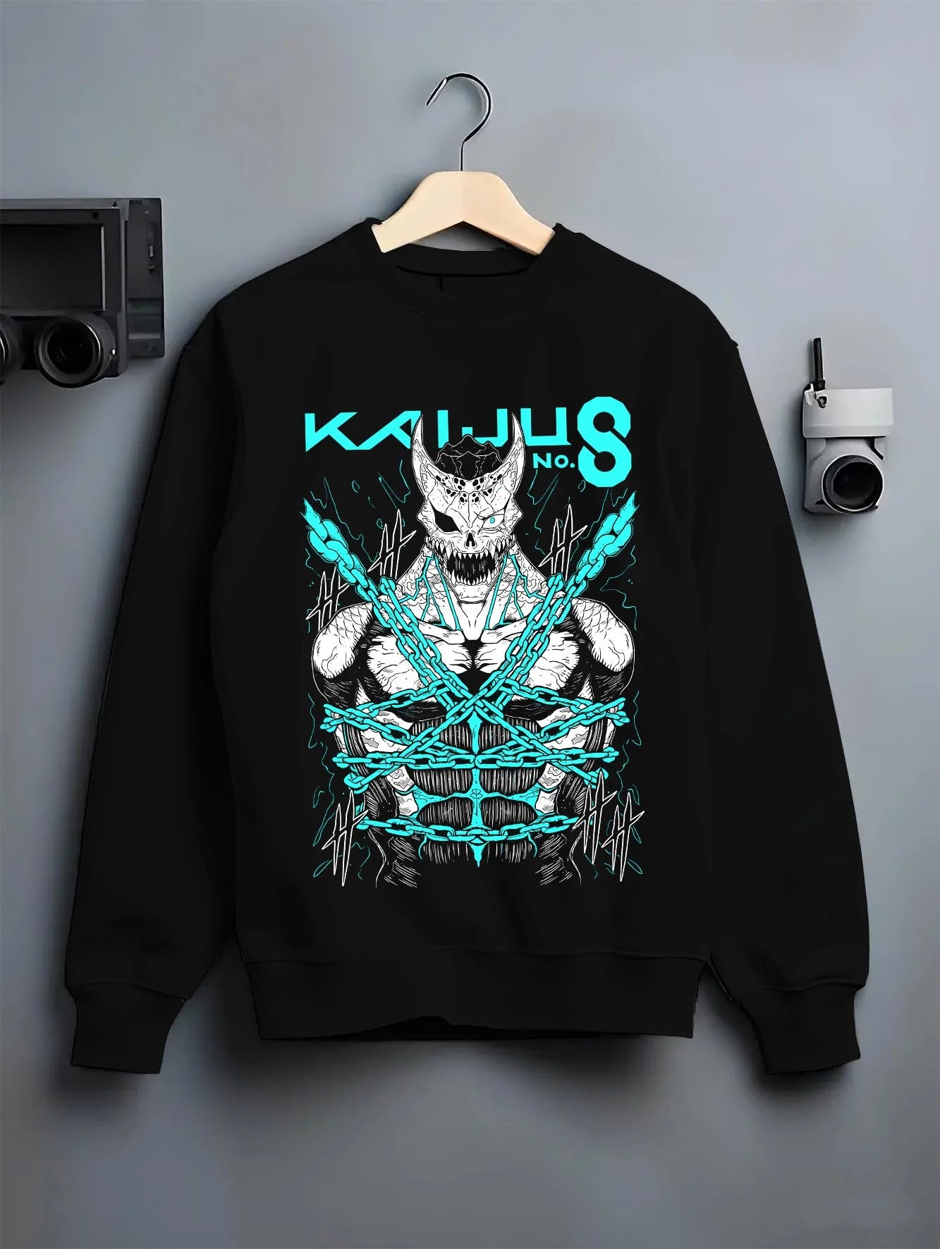 Black crewneck sweatshirt on hanger with Kaiju No. 8 Hoodie Kaiju Battle Transformation Form graphic premium wear.