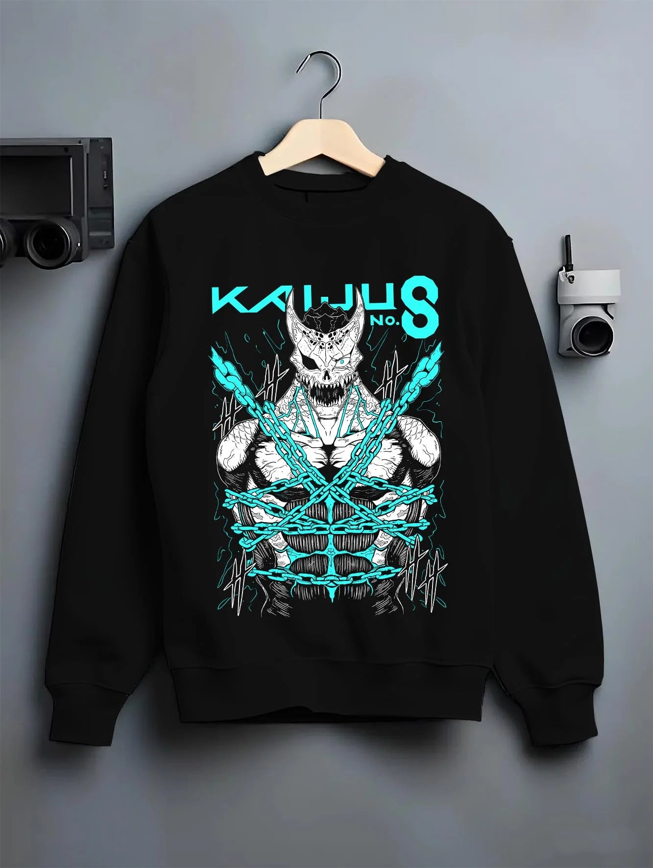 Black crewneck sweatshirt on hanger with Kaiju No. 8 Hoodie Kaiju Battle Transformation Form graphic premium wear.