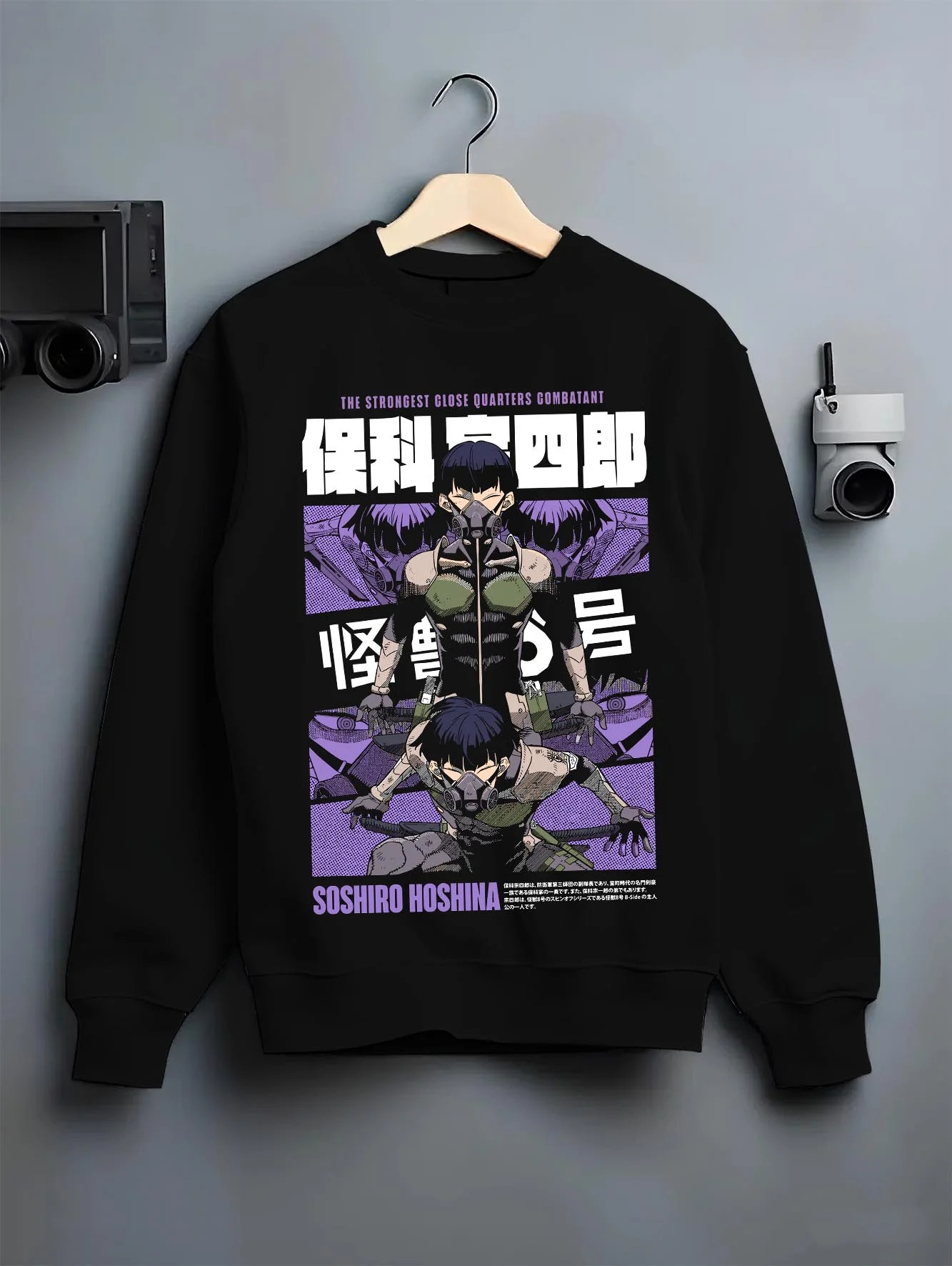Black crewneck sweatshirt on hanger with Soshiro Hoshina Hoodie Kaiju No. 8 Defense Force Captain graphic streetwear graphic.