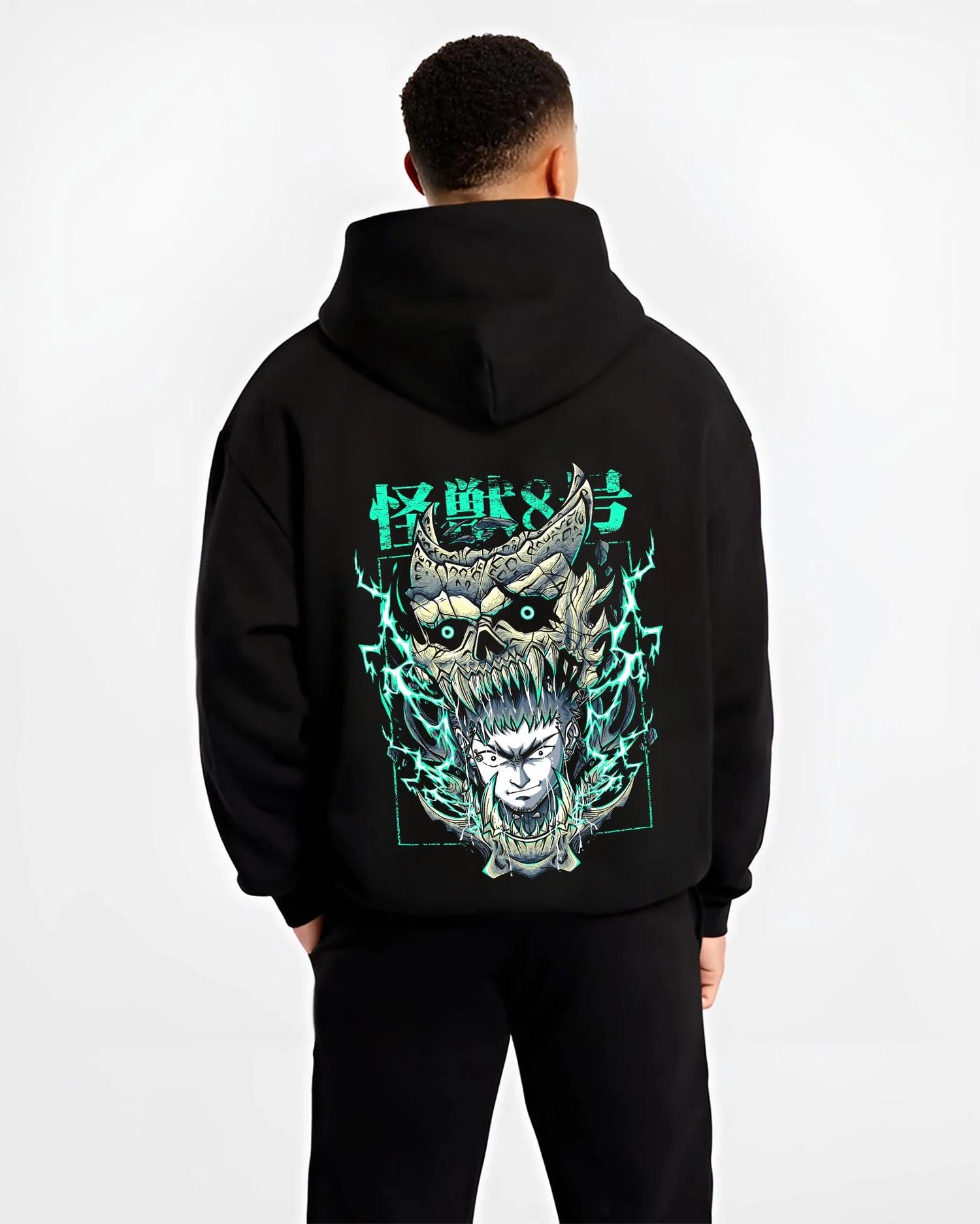 Black hoodie worn by male model, back view with Kaiju No. 8 Hoodie Kafka Hibino Fiery Skull Form graphic premium wear.