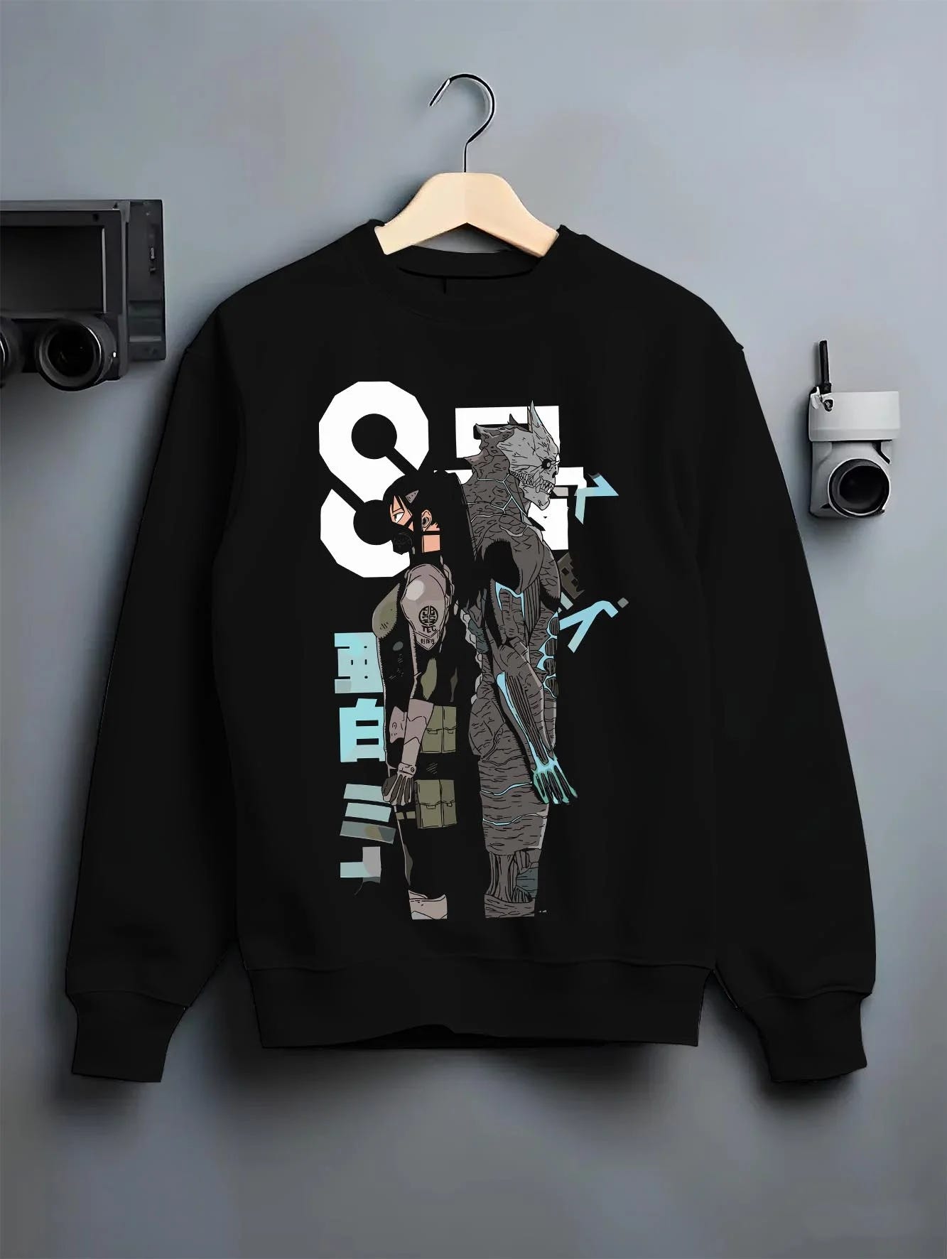 Black crewneck sweatshirt on hanger with Kaiju No. 8 Hoodie Final Form Heroic Moment graphic streetwear graphic.