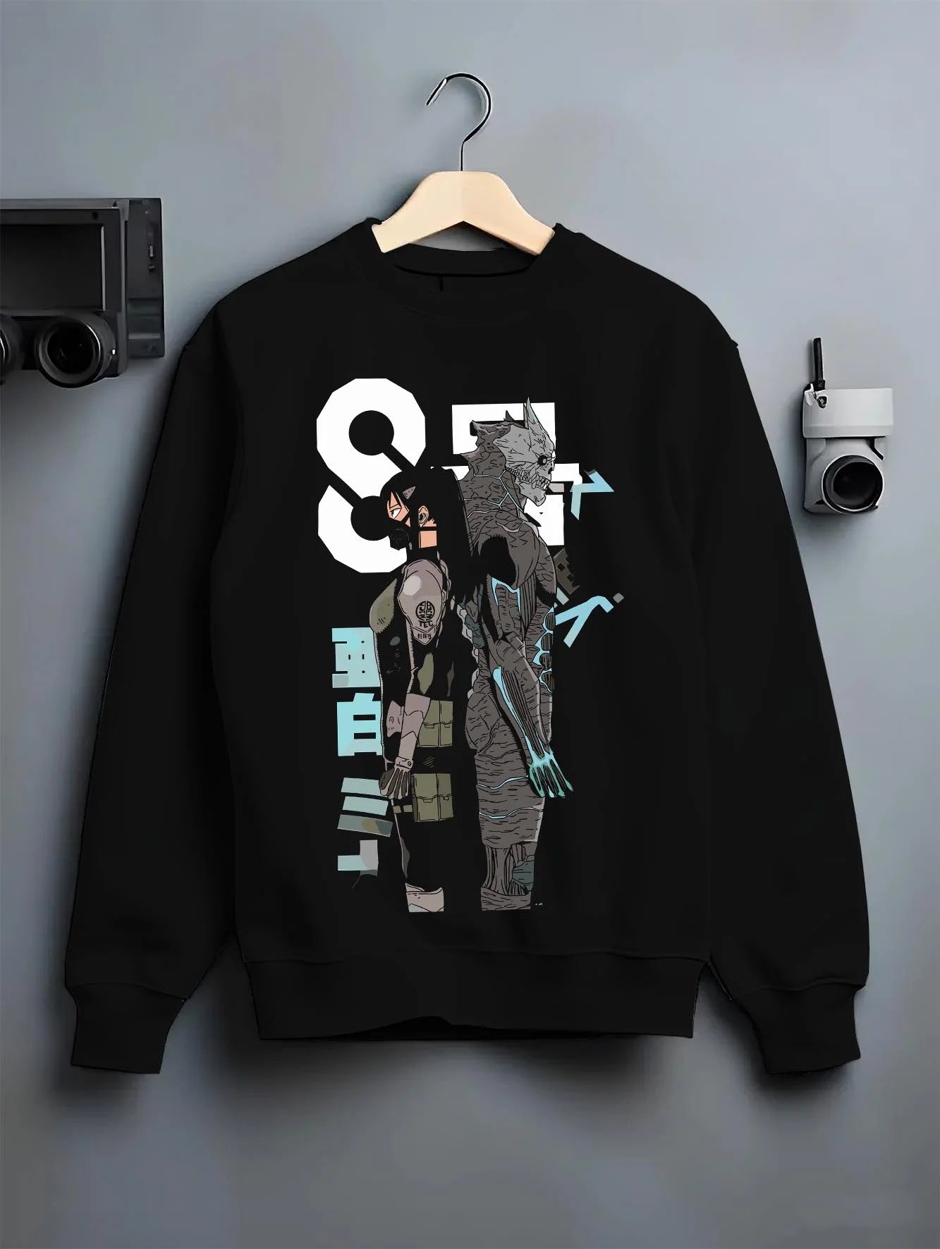 Black crewneck sweatshirt on hanger with Kaiju No. 8 Hoodie Final Form Heroic Moment graphic streetwear graphic.