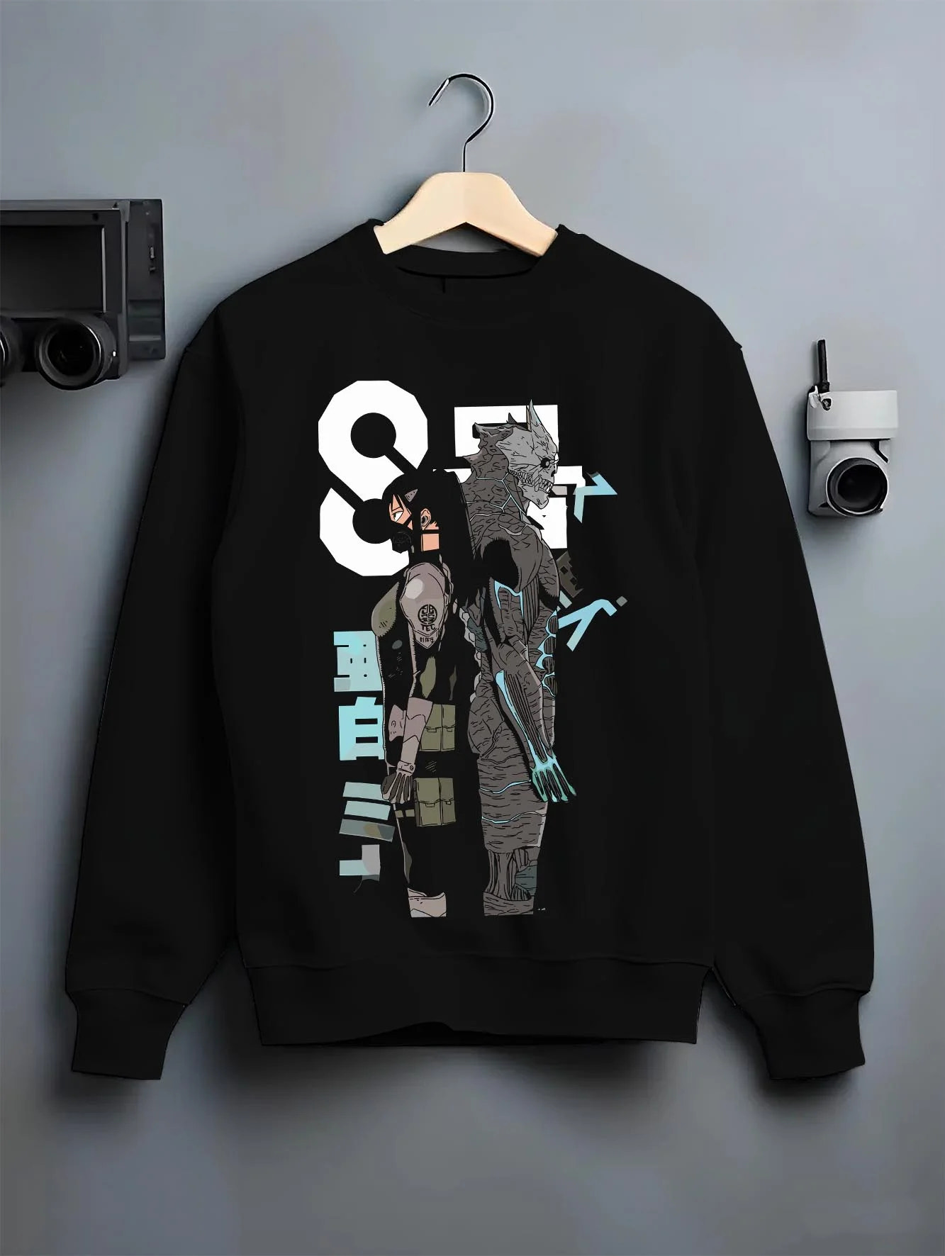 Black crewneck sweatshirt on hanger with Kaiju No. 8 Hoodie Final Form Heroic Moment graphic streetwear graphic.