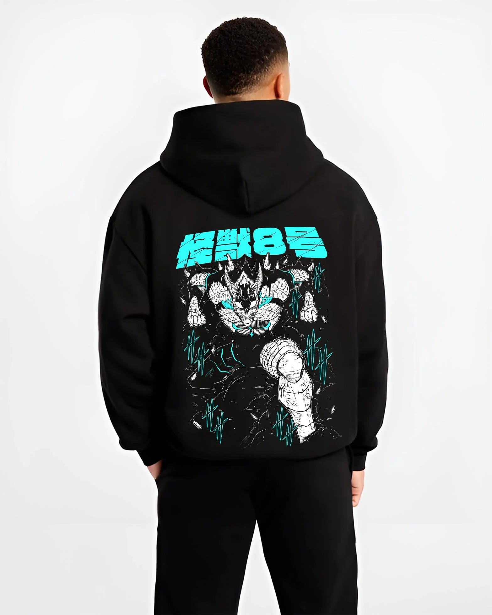 Black hoodie worn by male model, back view with Kaiju No. 8 Hoodie Monstrous Power Surge Pose graphic bold anime graphic.
