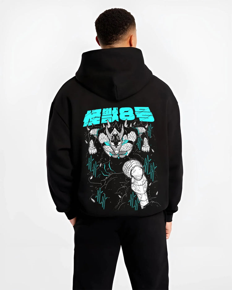 Black hoodie worn by male model, back view with Kaiju No. 8 Hoodie Monstrous Power Surge Pose graphic bold anime graphic.