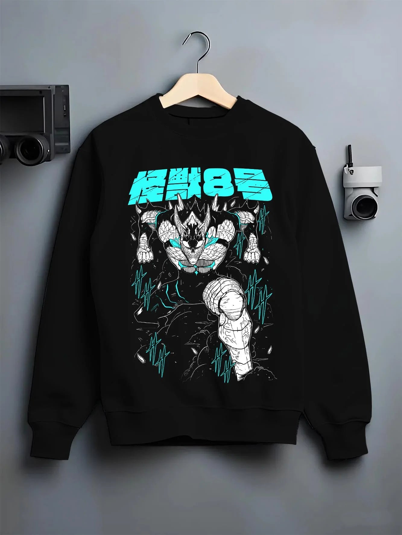 Black crewneck sweatshirt on hanger with Kaiju No. 8 Hoodie Monstrous Power Surge Pose graphic premium wear.