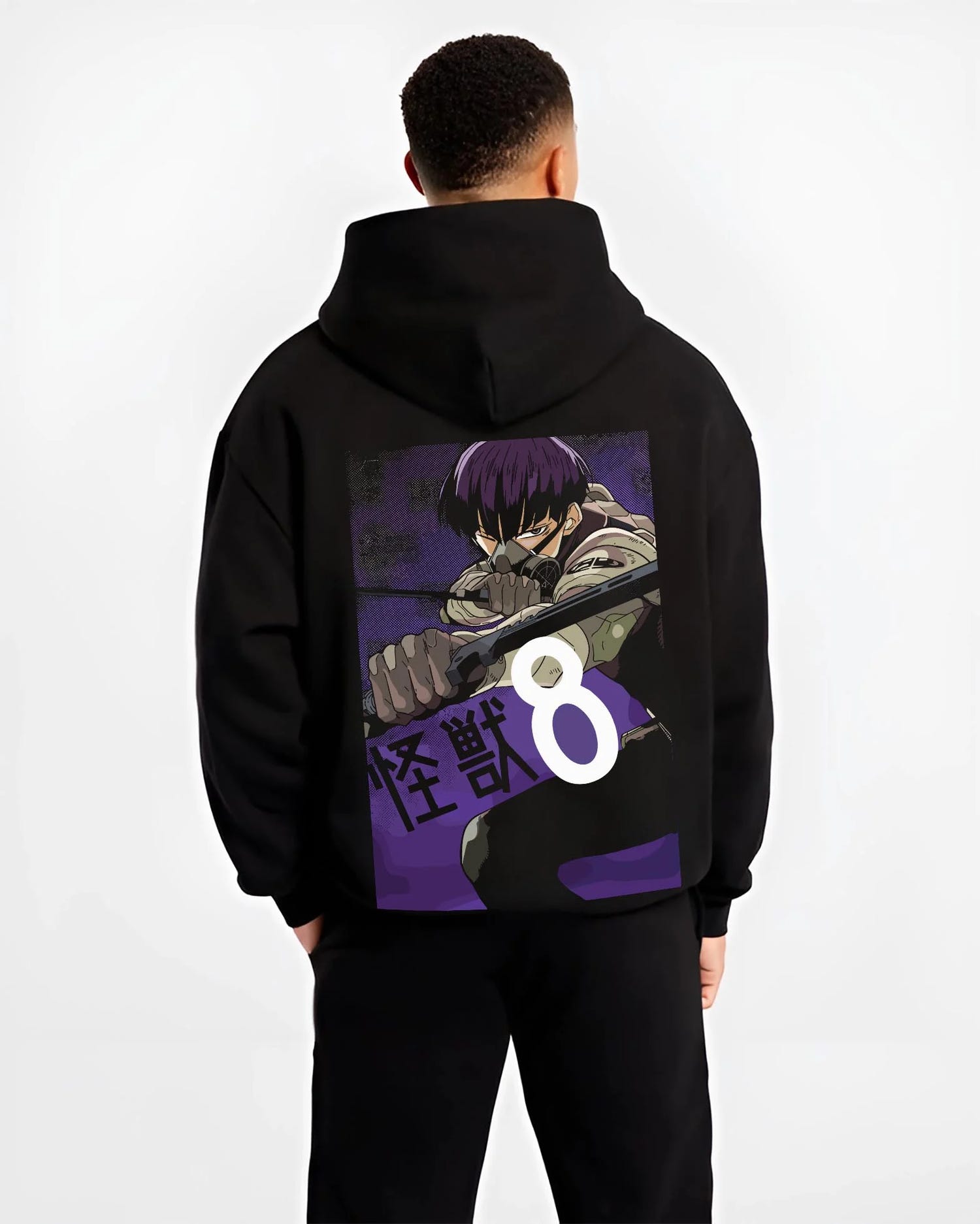 Black hoodie worn by male model, back view with Kaiju No. 8 Hoodie Squad Fighters Ready for Battle graphic bold anime graphic.