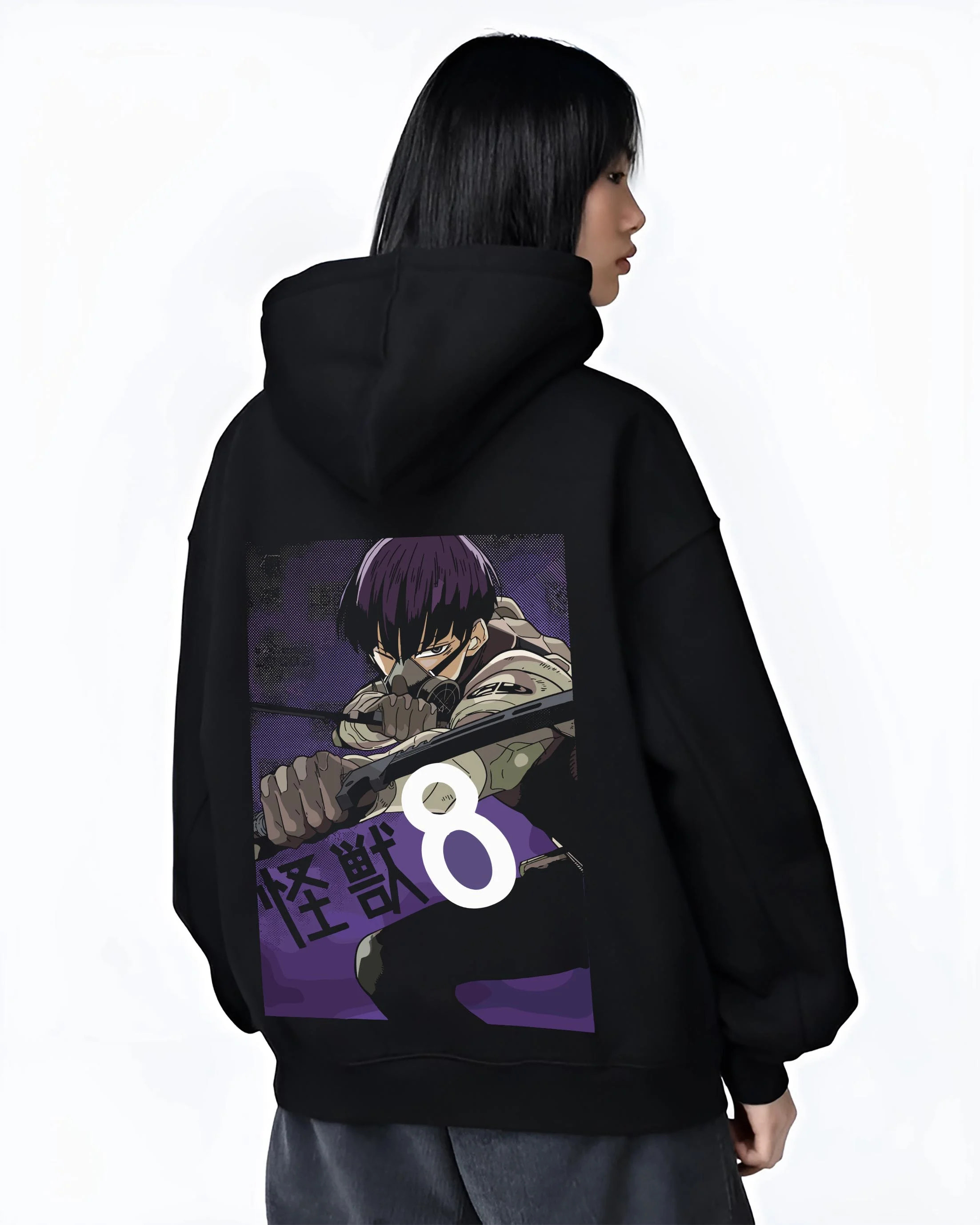 Black hoodie worn by female model, back view with Kaiju No. 8 Hoodie Squad Fighters Ready for Battle graphic bold anime graphic.