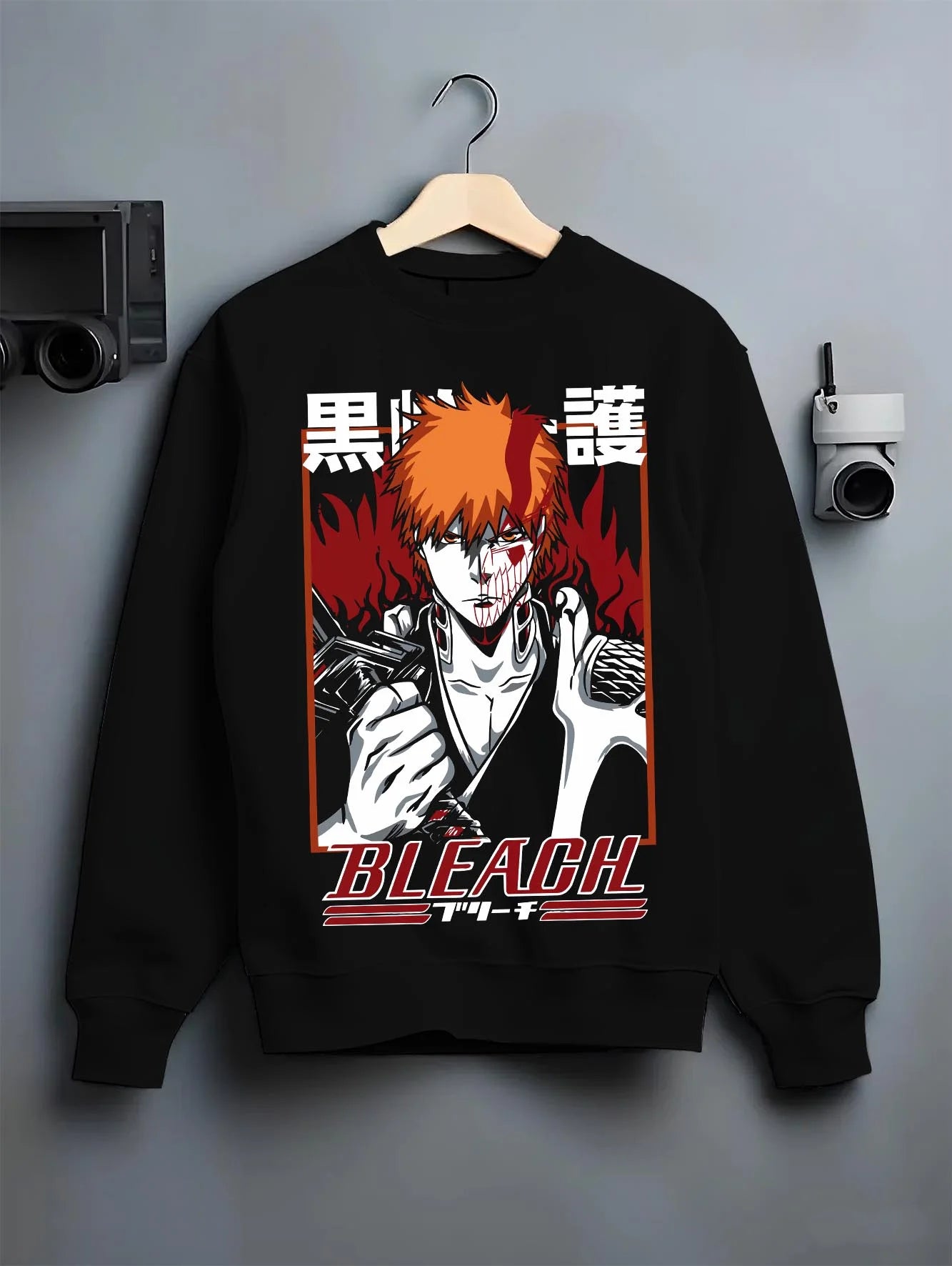 Black crewneck sweatshirt on hanger with Ichigo Bankai Battle Hoodie Bleach Anime Soul Reaper graphic streetwear graphic.