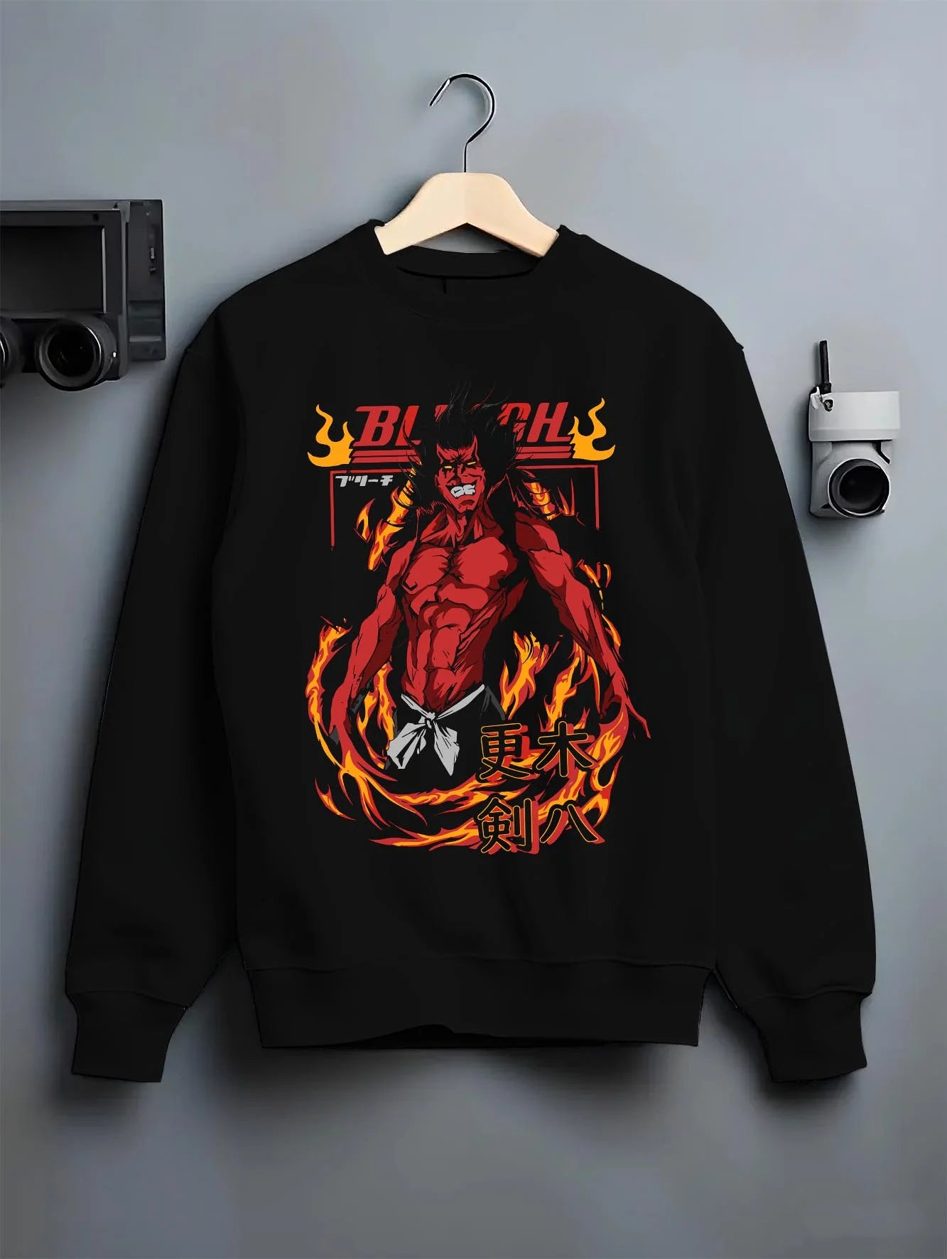 Black crewneck sweatshirt on hanger with Kenpachi Zaraki Hoodie Bleach Anime Captain Retro graphic bold anime graphic.