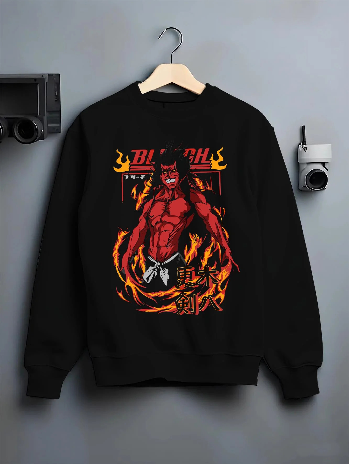 Black crewneck sweatshirt on hanger with Kenpachi Zaraki Hoodie Bleach Anime Captain Retro graphic bold anime graphic.