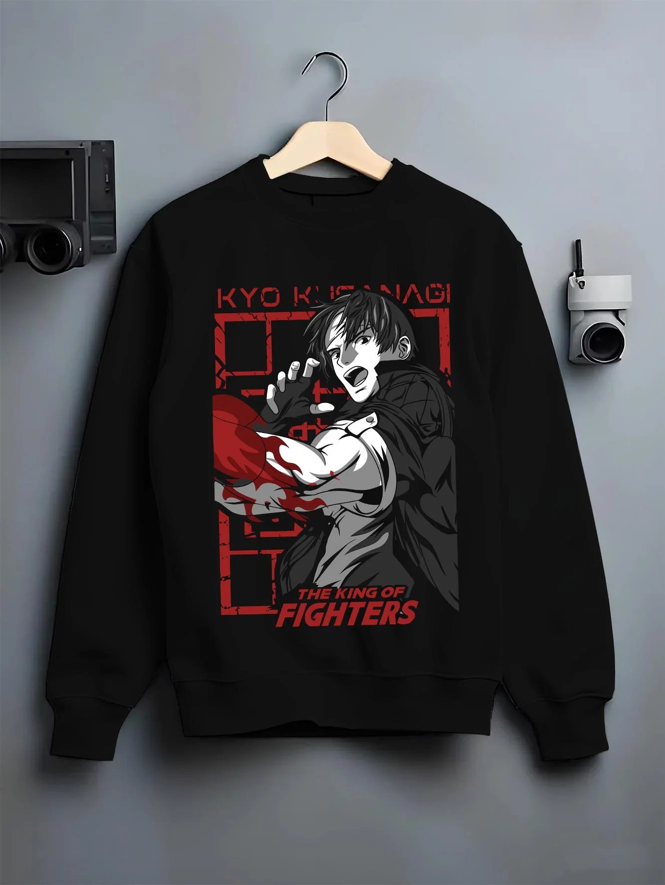 Black crewneck sweatshirt on hanger with King of Fighters Hoodie Ryo Sakazaki Fighting Stance graphic premium wear.
