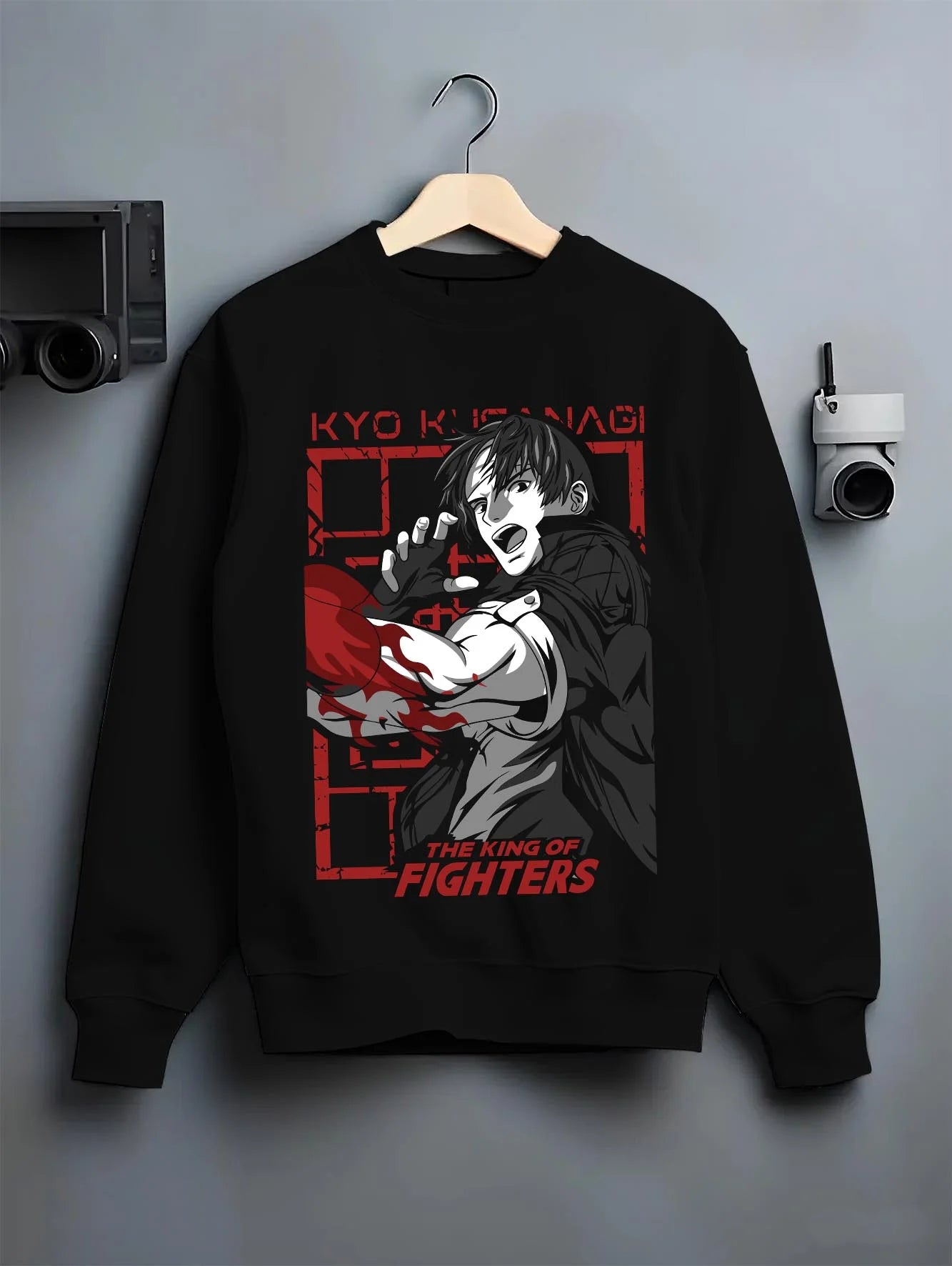Black crewneck sweatshirt on hanger with King of Fighters Hoodie Ryo Sakazaki Fighting Stance graphic premium wear.