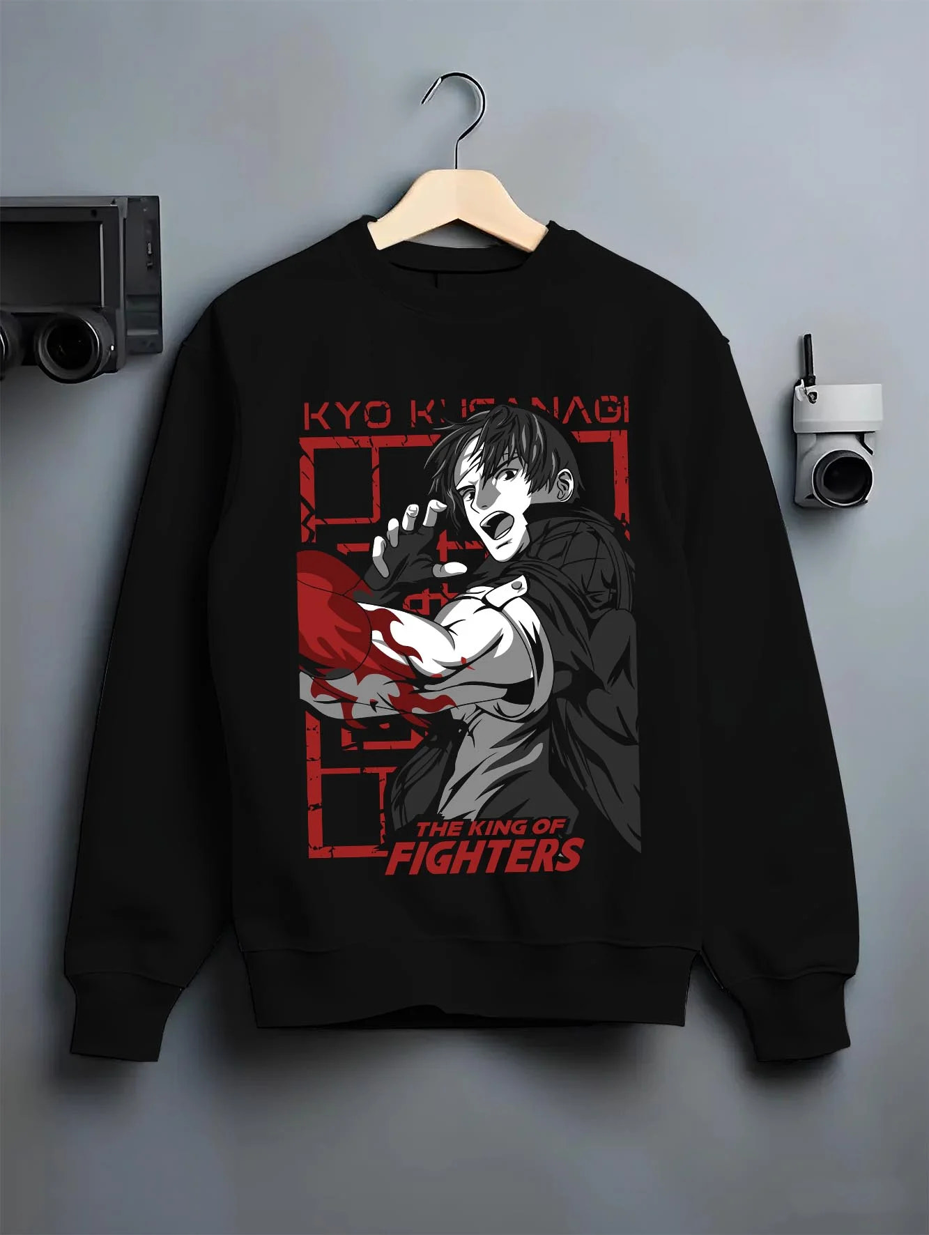 Black crewneck sweatshirt on hanger with King of Fighters Hoodie Ryo Sakazaki Fighting Stance graphic premium wear.