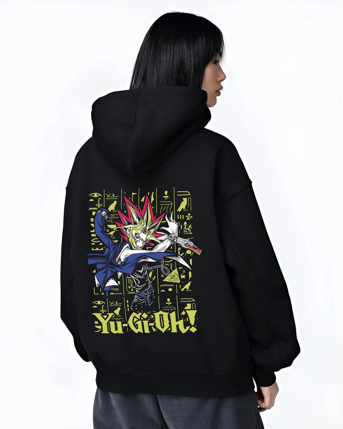 Black hoodie worn by female model from the back featuring Yugi King of Games Millennium Puzzle artwork.