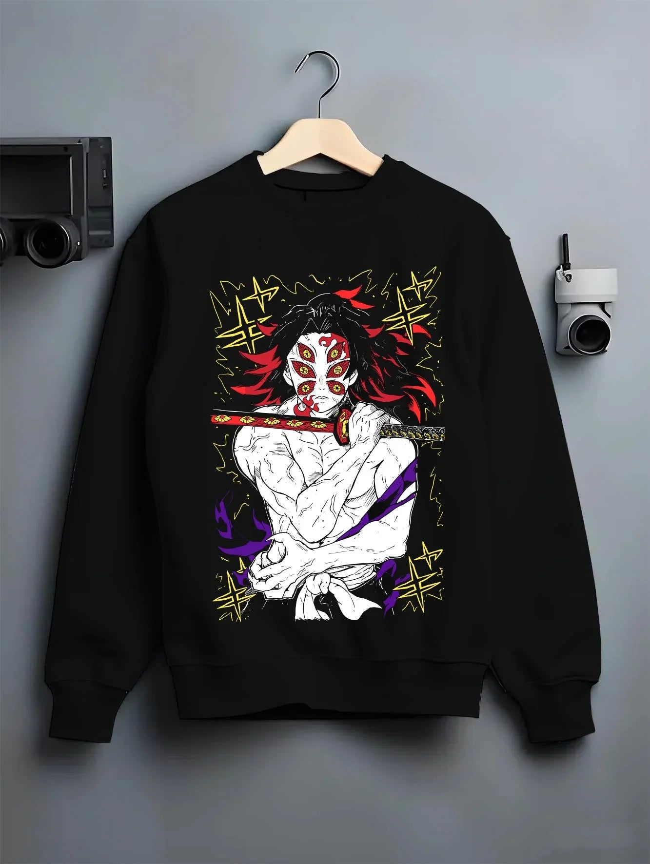 Black crewneck sweatshirt on hanger with Kimetsu no Yaiba Hoodie Upper Moon Douma Eye Mask graphic streetwear graphic.