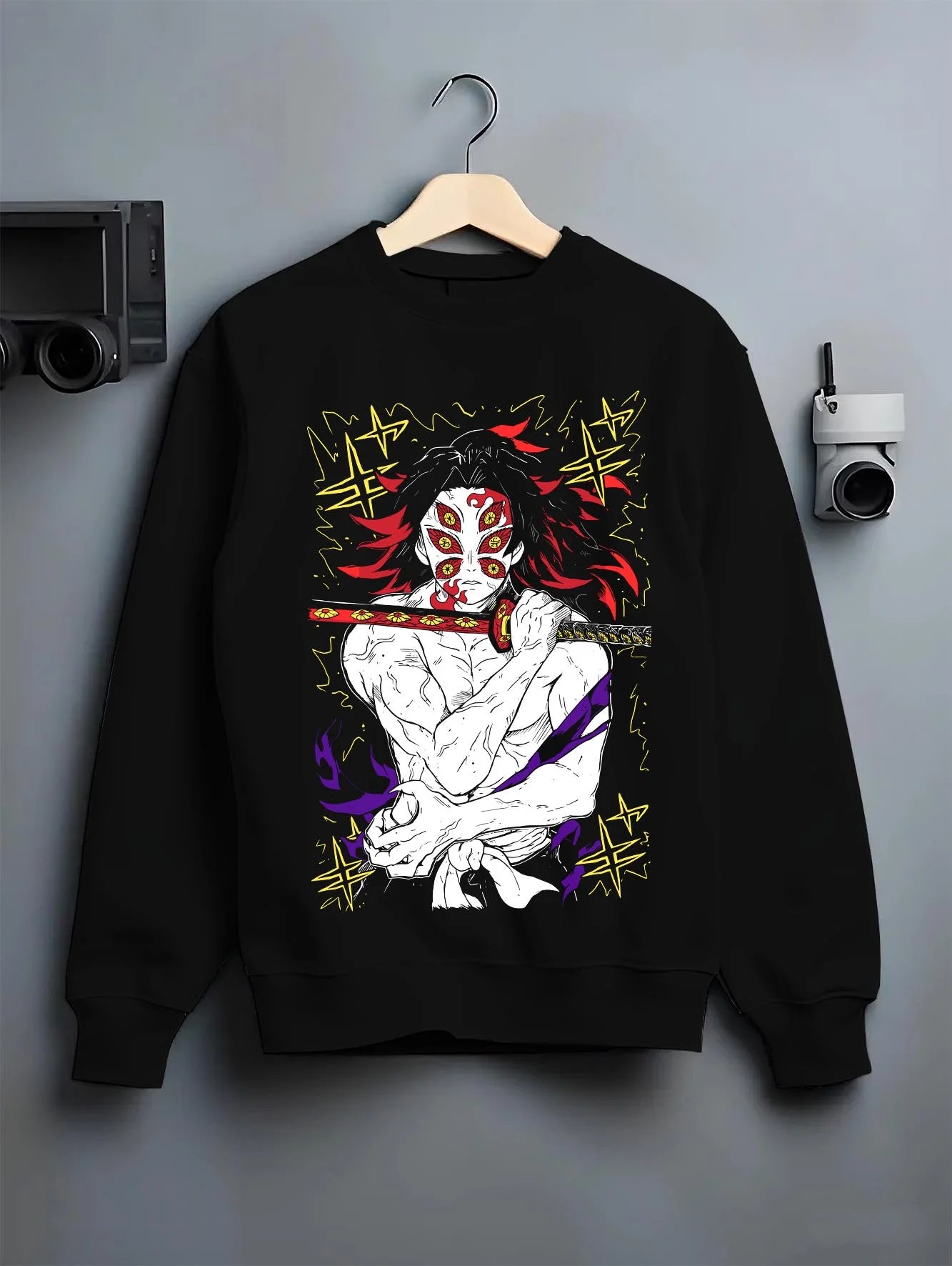 Black crewneck sweatshirt on hanger with Kimetsu no Yaiba Hoodie Upper Moon Douma Eye Mask graphic streetwear graphic.