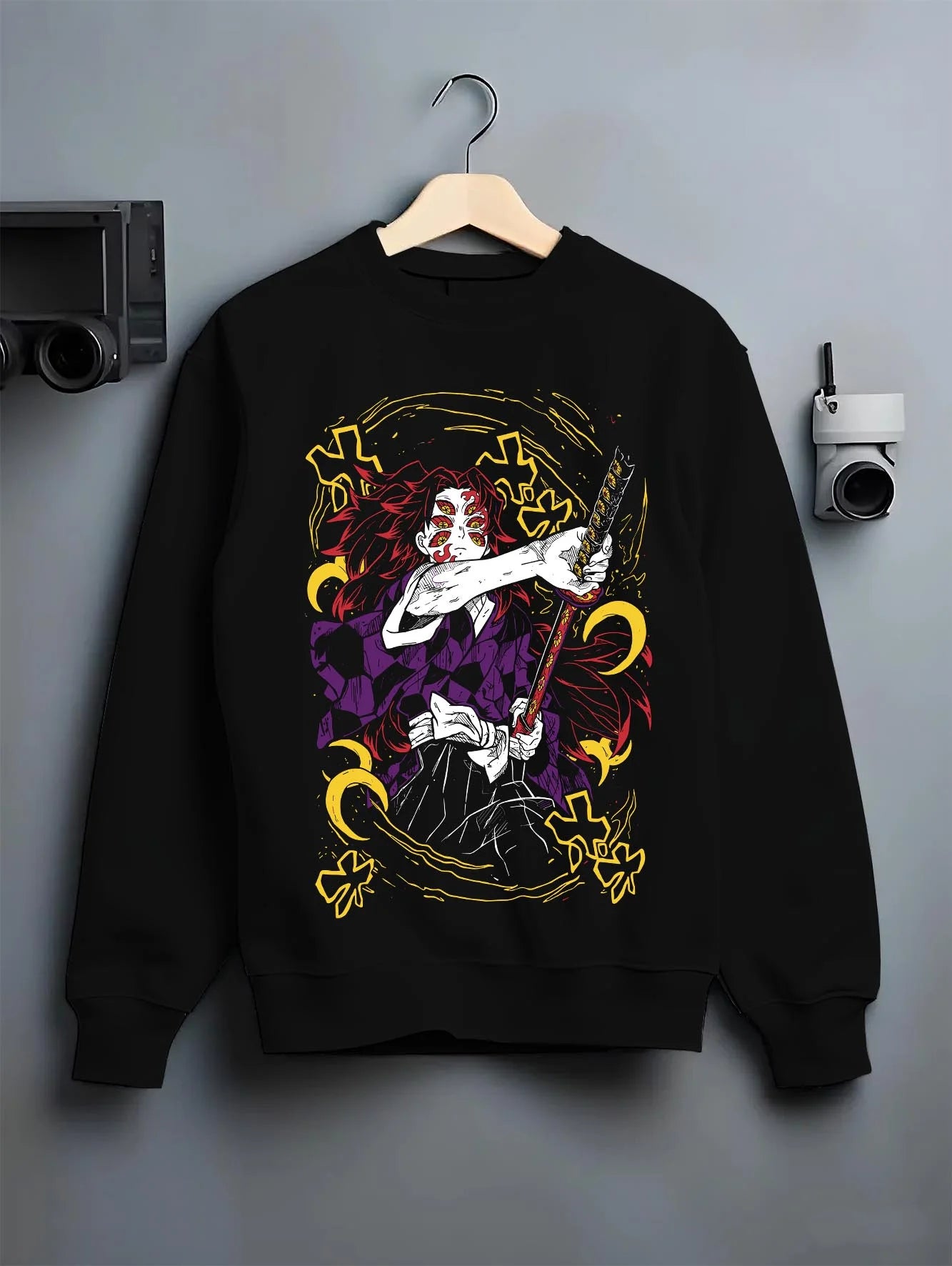 Black crewneck sweatshirt on hanger with Kimetsu no Yaiba Hoodie Upper Moon Kokushibo Crescent graphic bold anime graphic.