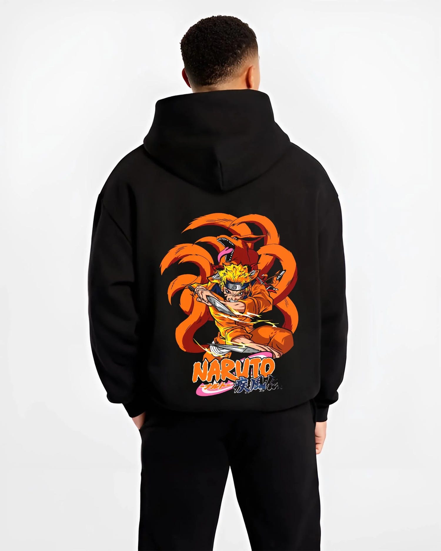 Black hoodie worn by male model, back view with Kaiju No. 8 Monster Transformation Hoodie Epic Battle graphic premium wear.