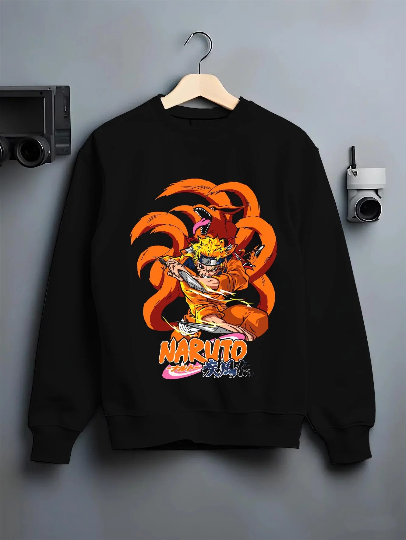 Black crewneck sweatshirt on hanger with Kaiju No. 8 Monster Transformation Hoodie Epic Battle graphic premium wear.