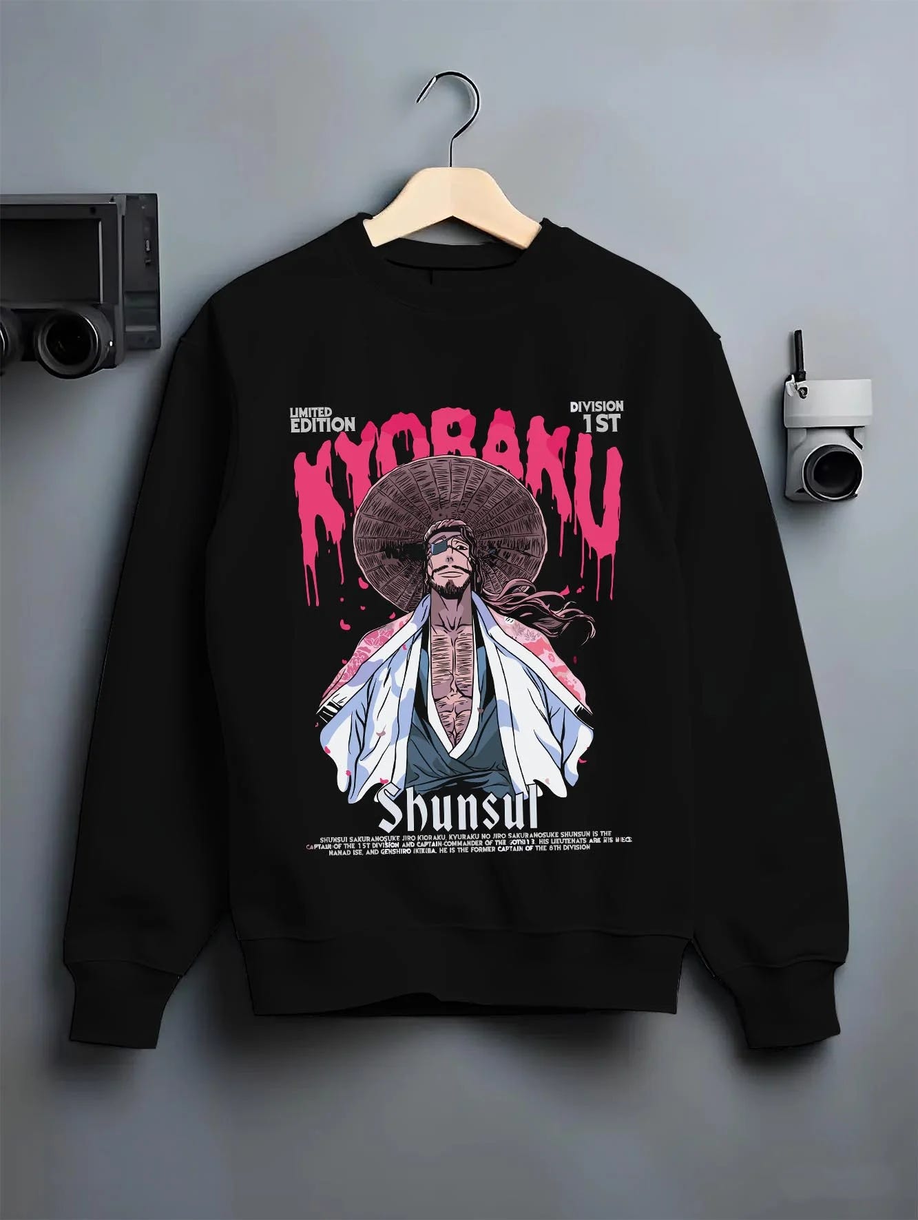 Black crewneck sweatshirt on hanger with Kaiju No. 8 Defense Force Team Hoodie Tactical graphic premium wear.