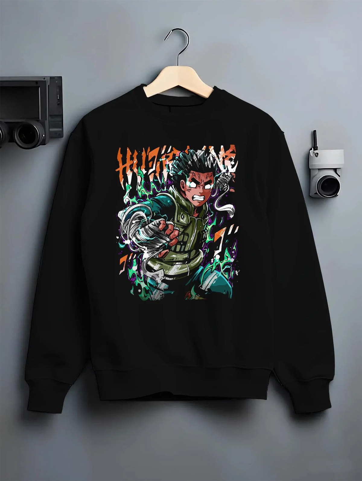 Black crewneck sweatshirt on hanger featuring Rock Lee training and taijutsu artwork.