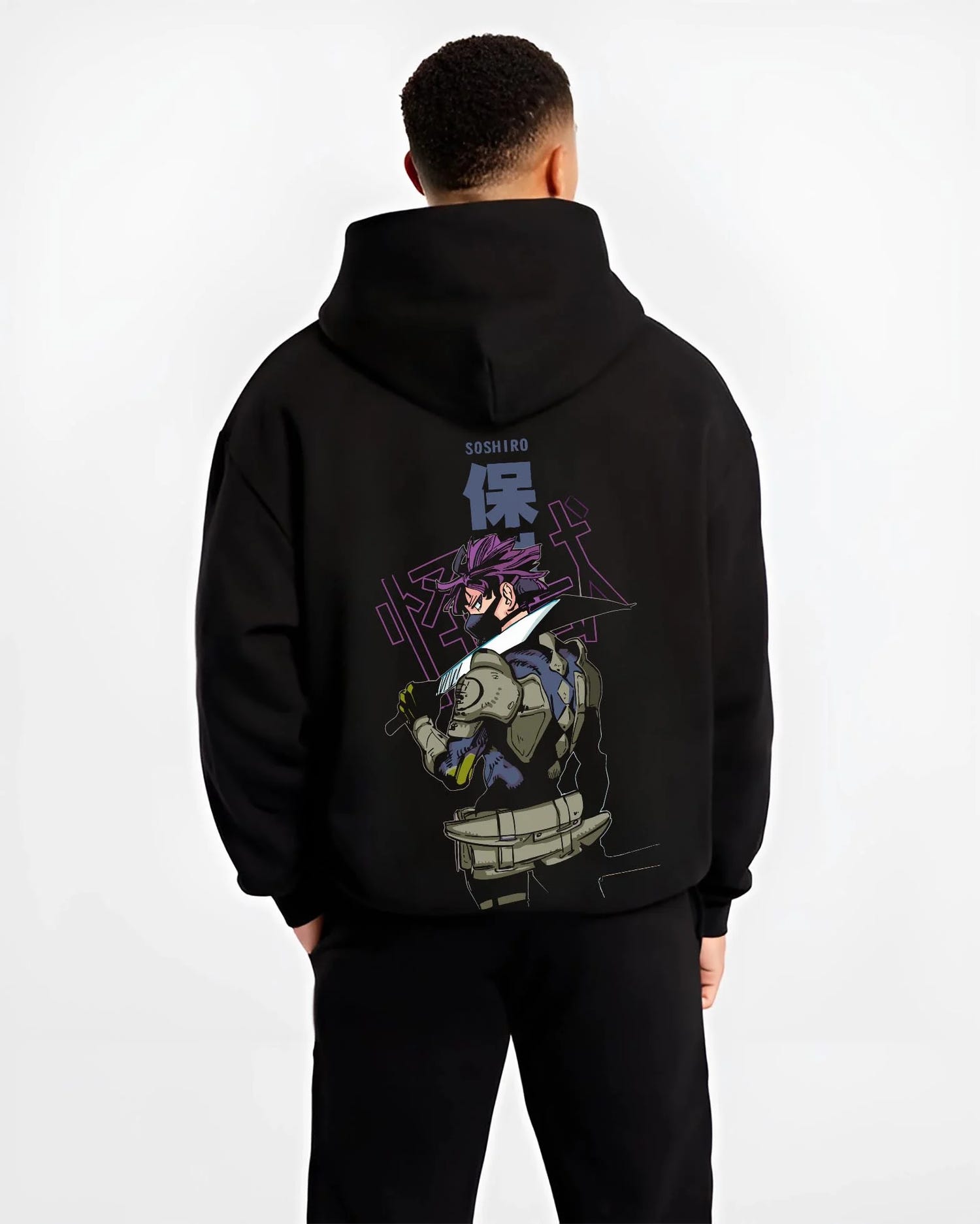Black hoodie worn by male model, back view with Kaiju No. 8 Battle Stance Transformation Hoodie graphic bold anime graphic.