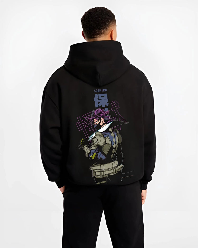 Black hoodie worn by male model, back view with Kaiju No. 8 Battle Stance Transformation Hoodie graphic bold anime graphic.