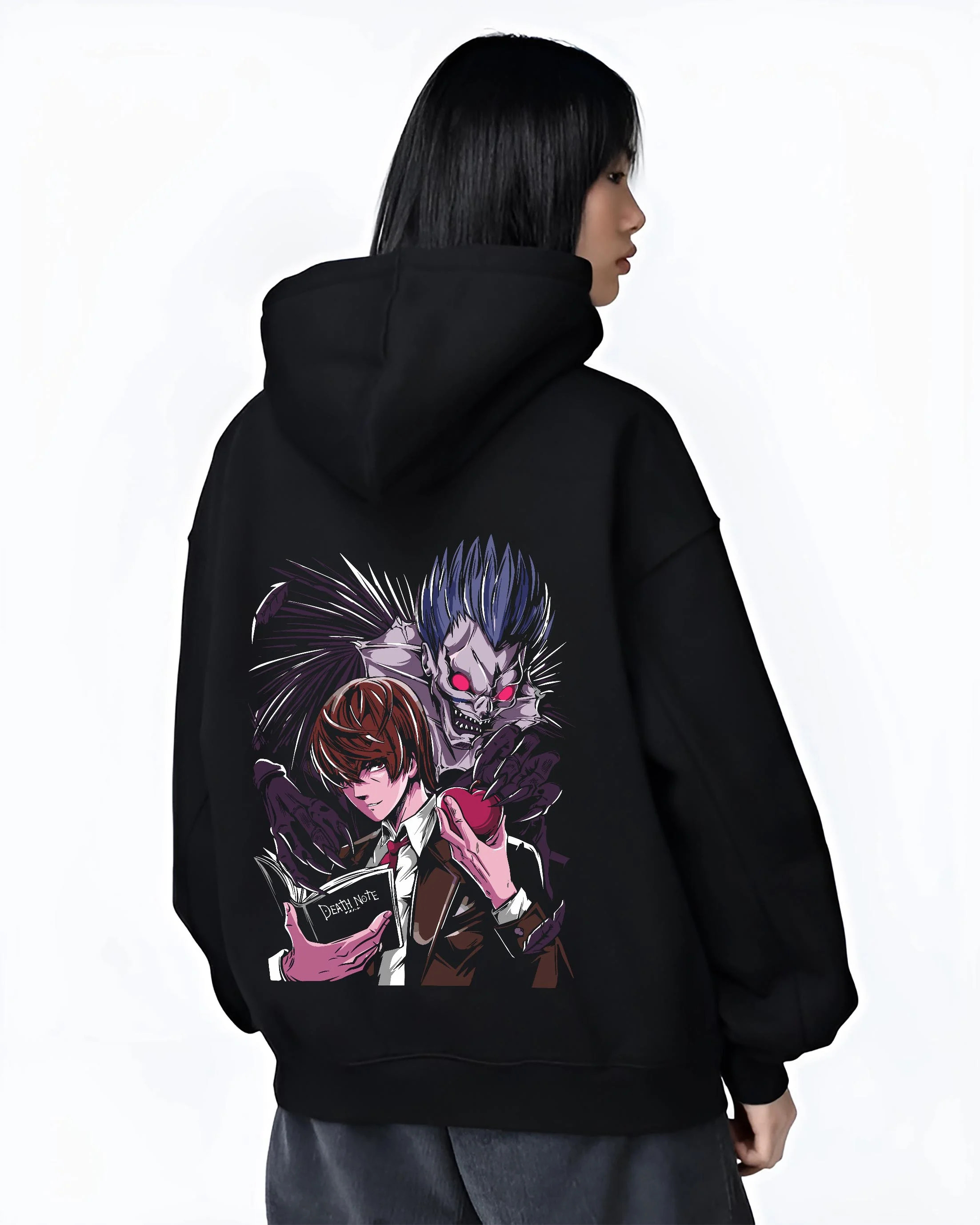 Black hoodie worn by female model, back view with Ryuk Hoodie Death Note Shinigami Dark Aesthetic graphic bold anime graphic.