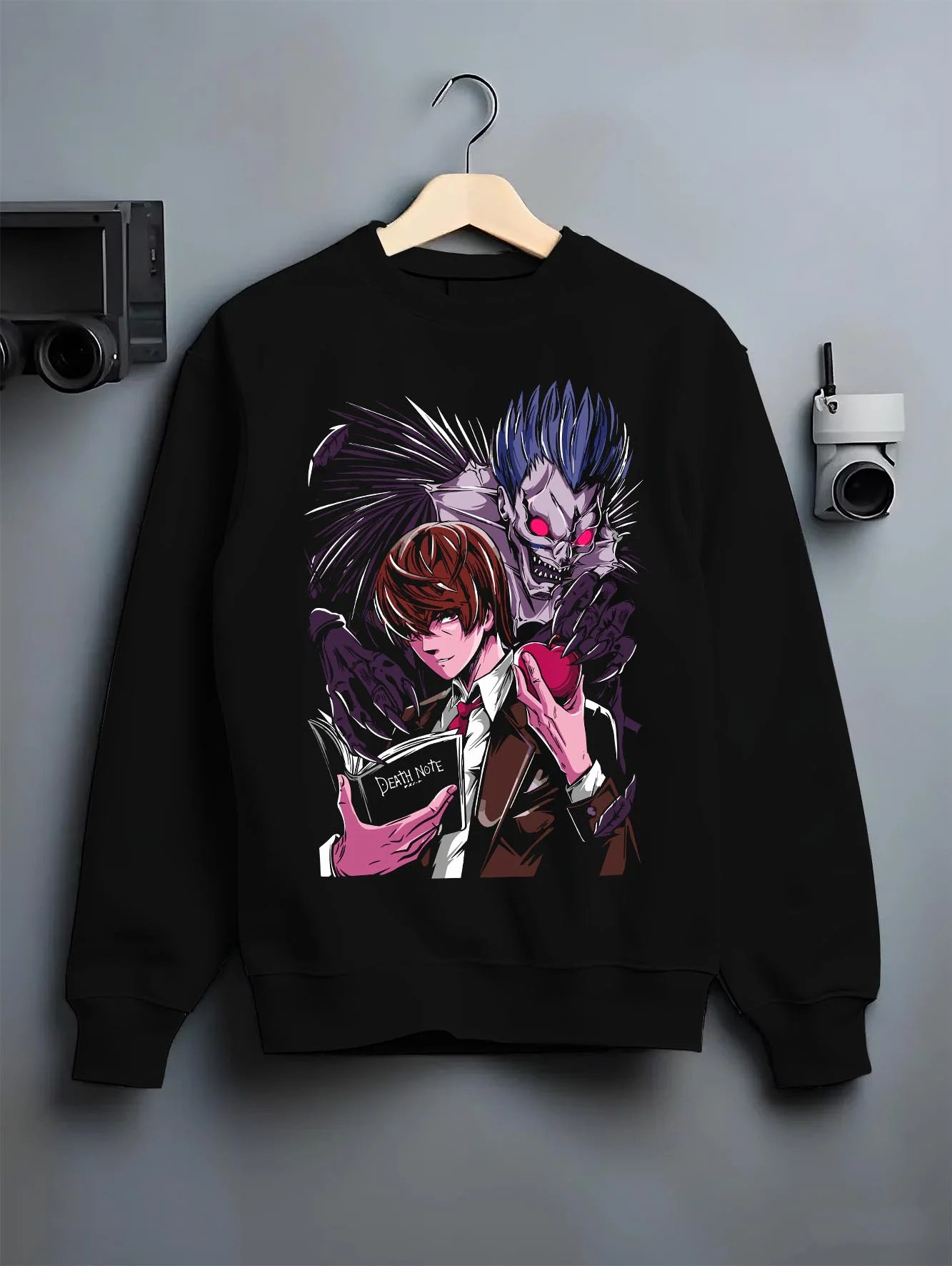 Black crewneck sweatshirt on hanger with Ryuk Hoodie Death Note Shinigami Dark Aesthetic graphic bold anime graphic.