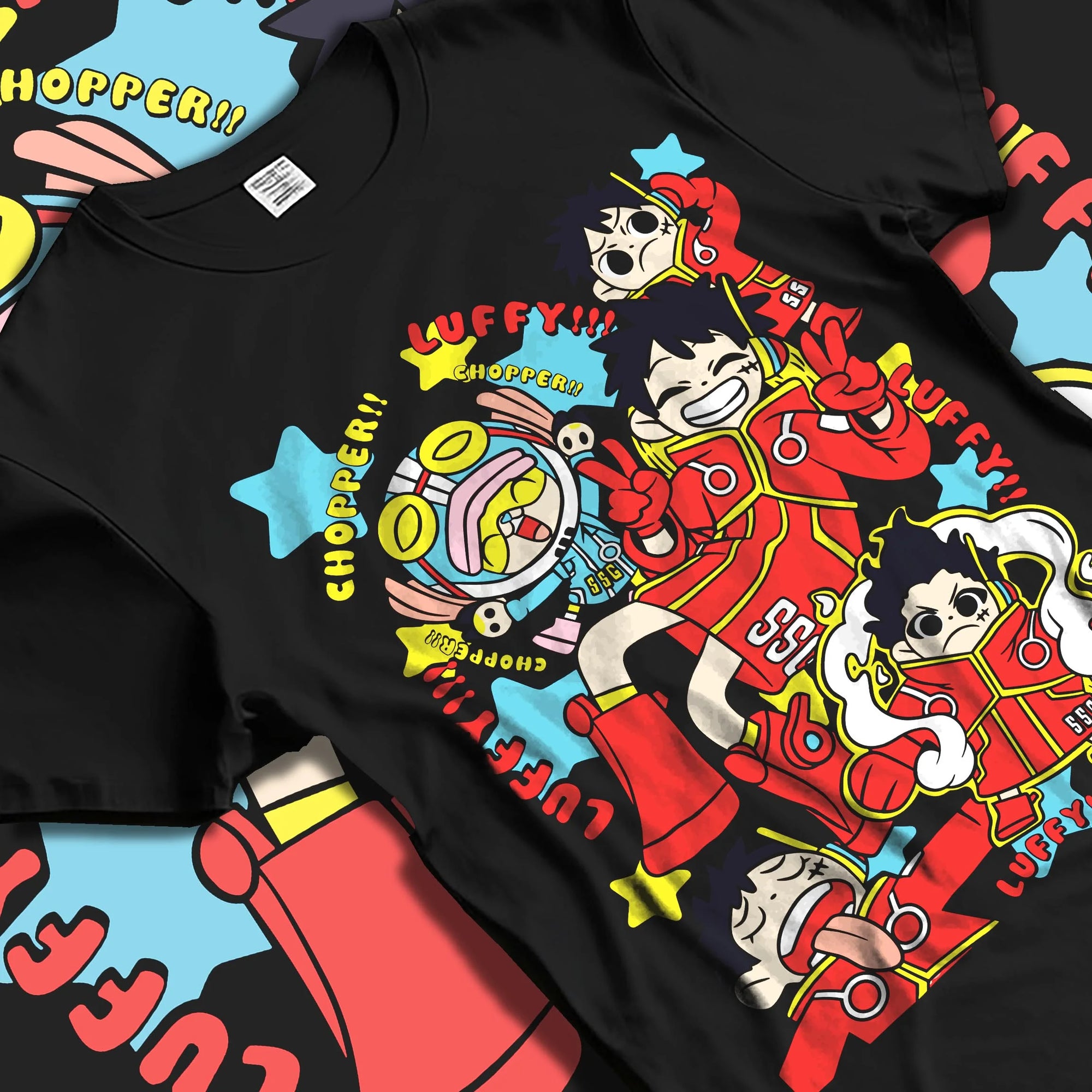 Black T-shirt laid flat with natural folds displaying vibrant retro streetwear graphic of Luffy and Chopper from One Piece anime.