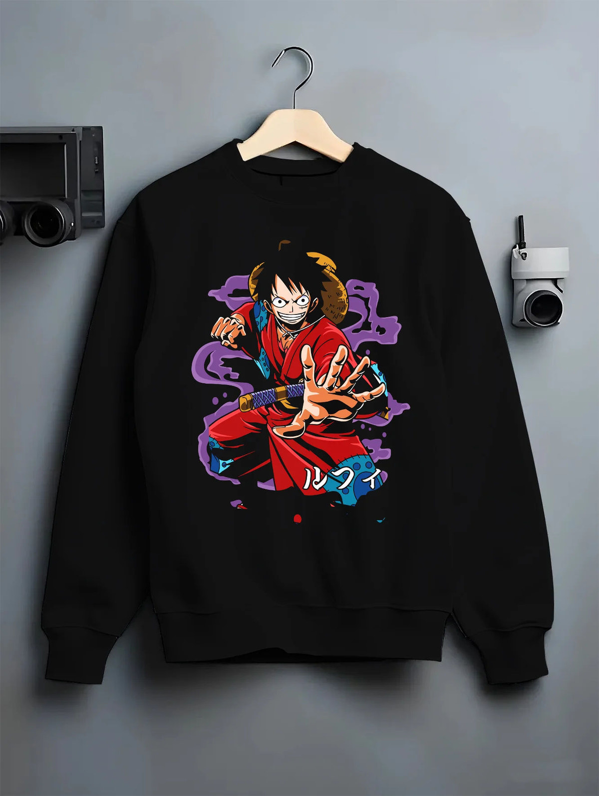 Black crewneck sweatshirt on hanger showing Monkey D. Luffy from One Piece: red coat battle pose